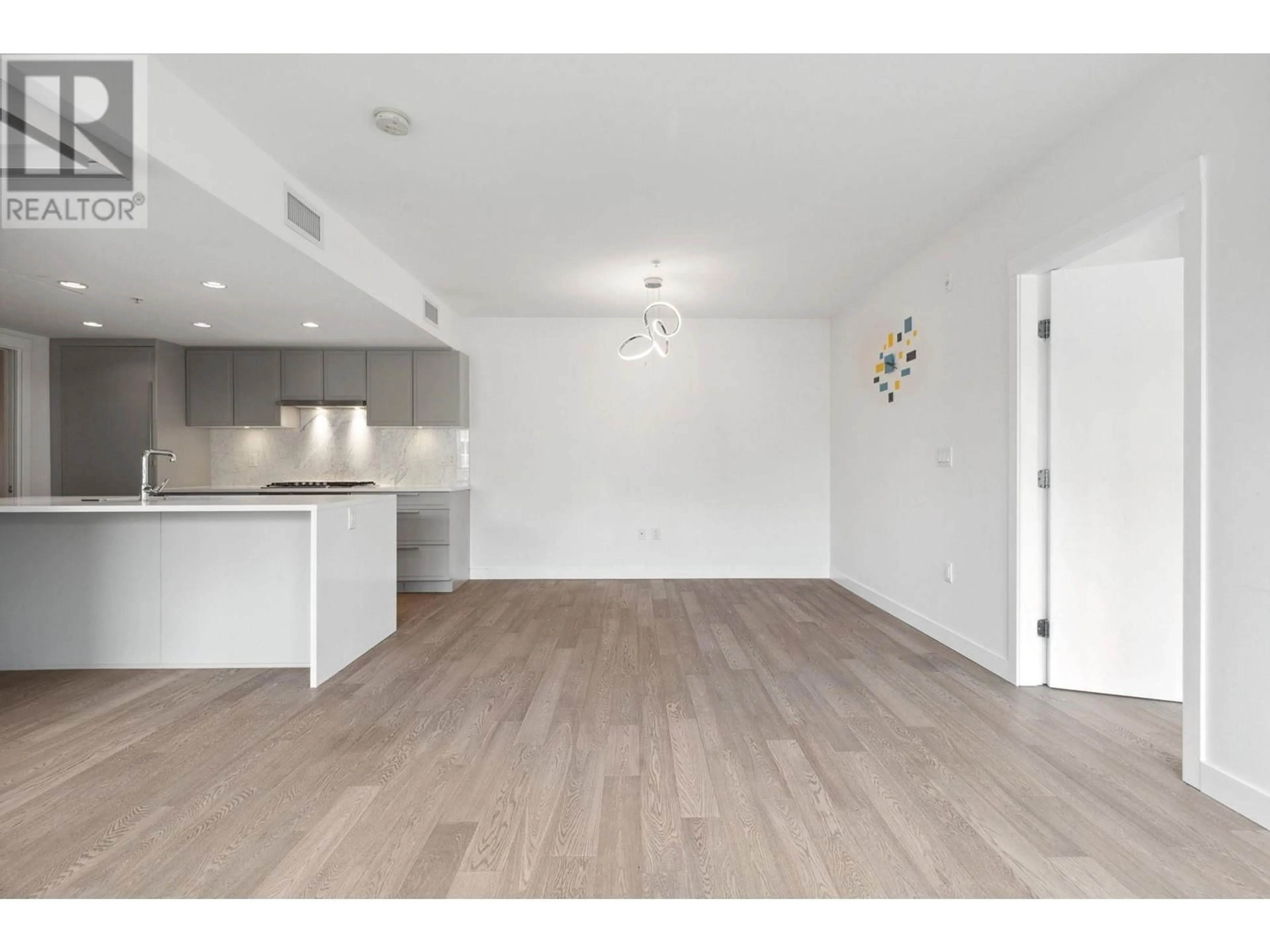 Open concept kitchen, wood/laminate floor for 223 - 7828 GRANVILLE STREET, Vancouver British Columbia V6P4Z2