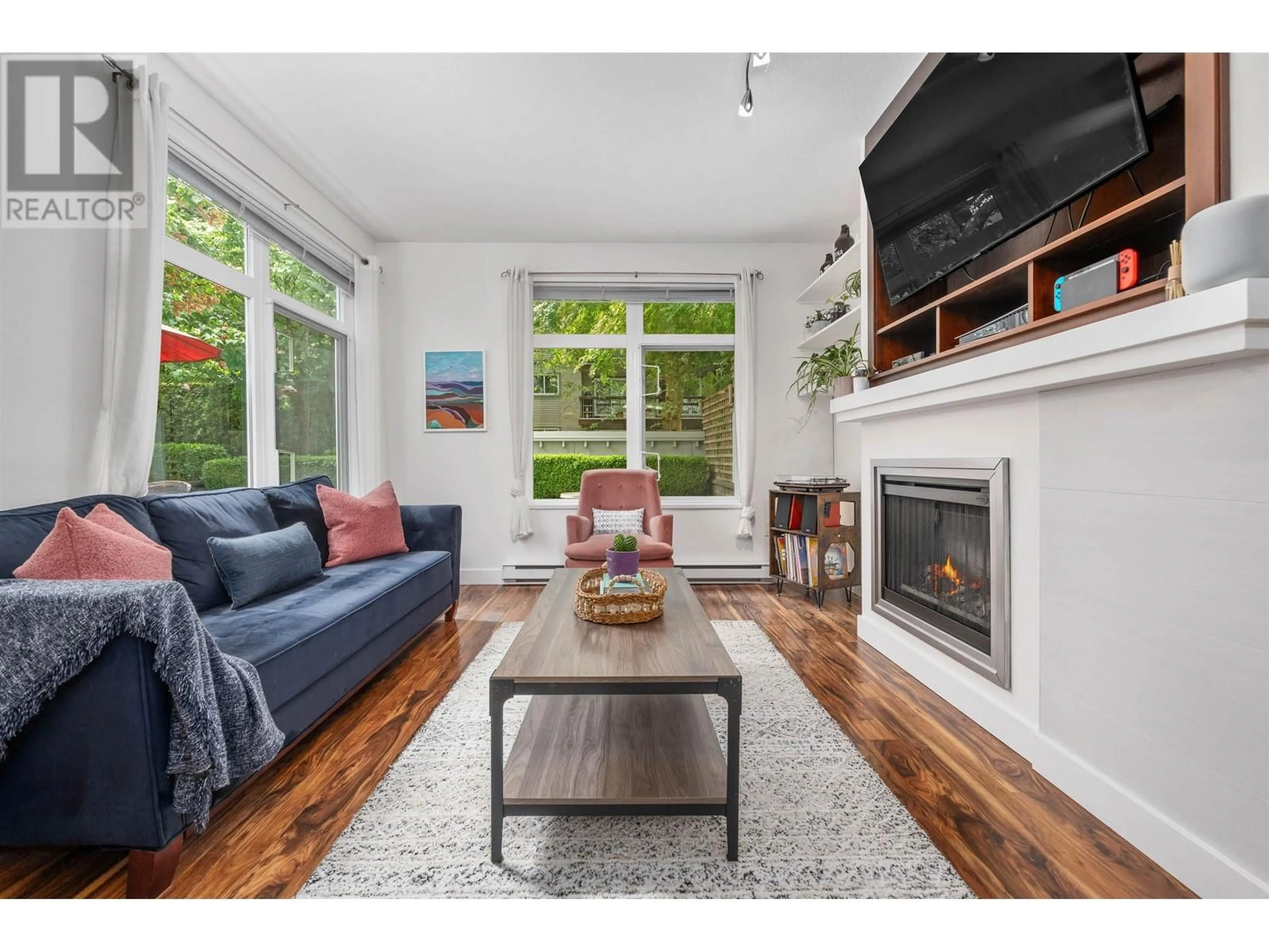 Living room with furniture, wood/laminate floor for 118 - 2368 MARPOLE AVENUE, Port Coquitlam British Columbia V3C2A2