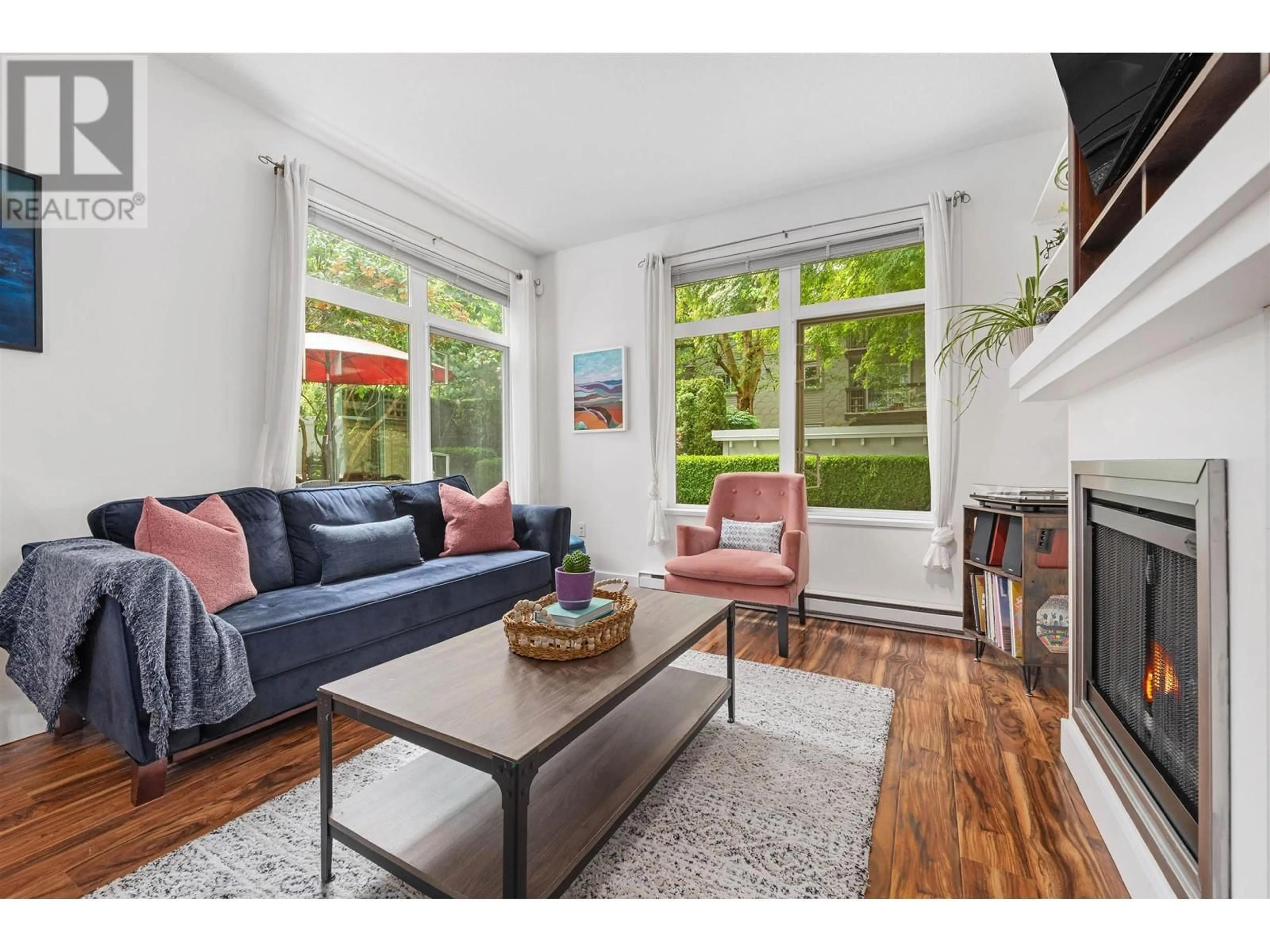 Living room with furniture, wood/laminate floor for 118 - 2368 MARPOLE AVENUE, Port Coquitlam British Columbia V3C2A2