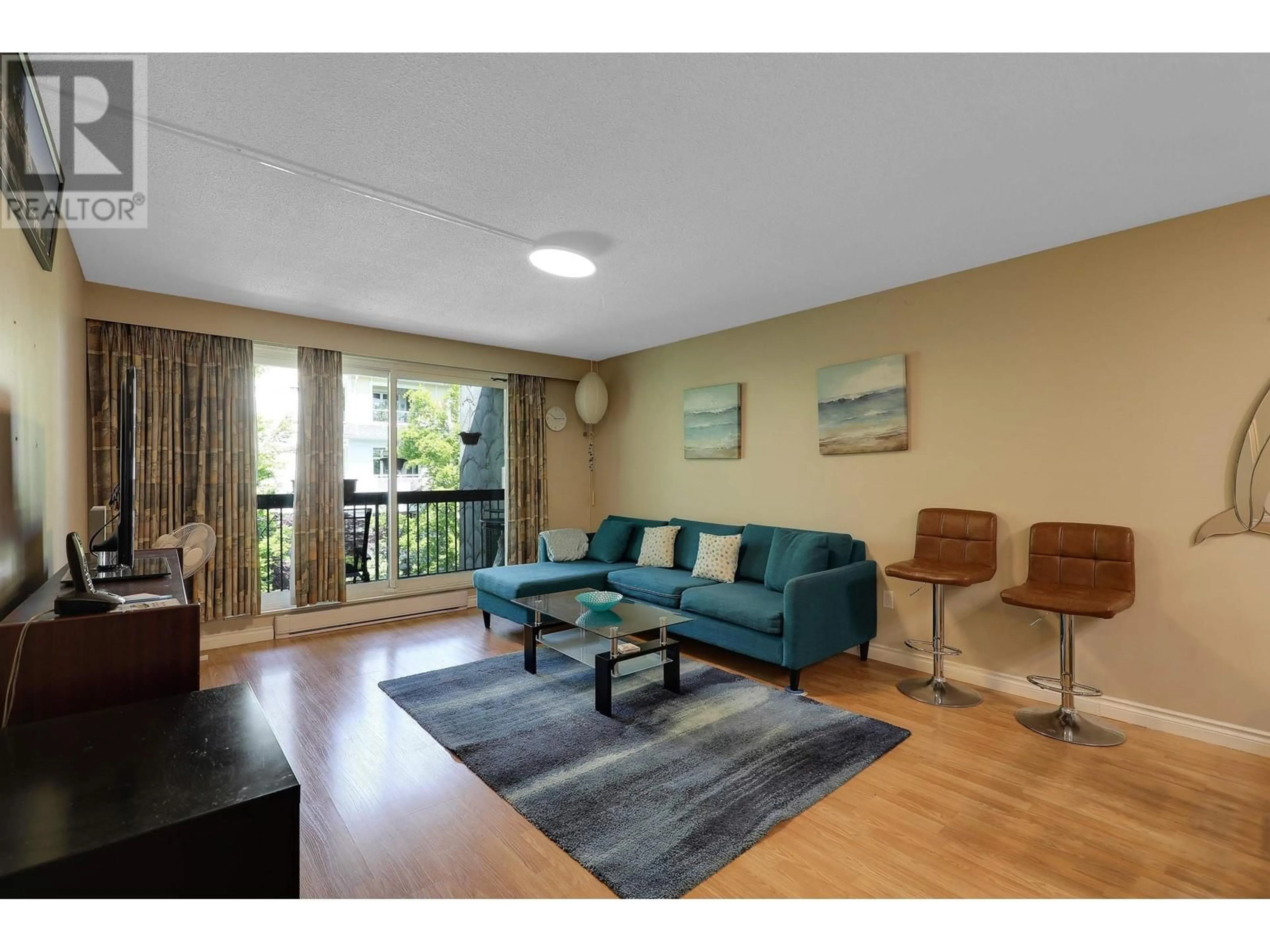 Living room with furniture, wood/laminate floor for 308 - 2381 BURY AVENUE, Port Coquitlam British Columbia V3C1Z9