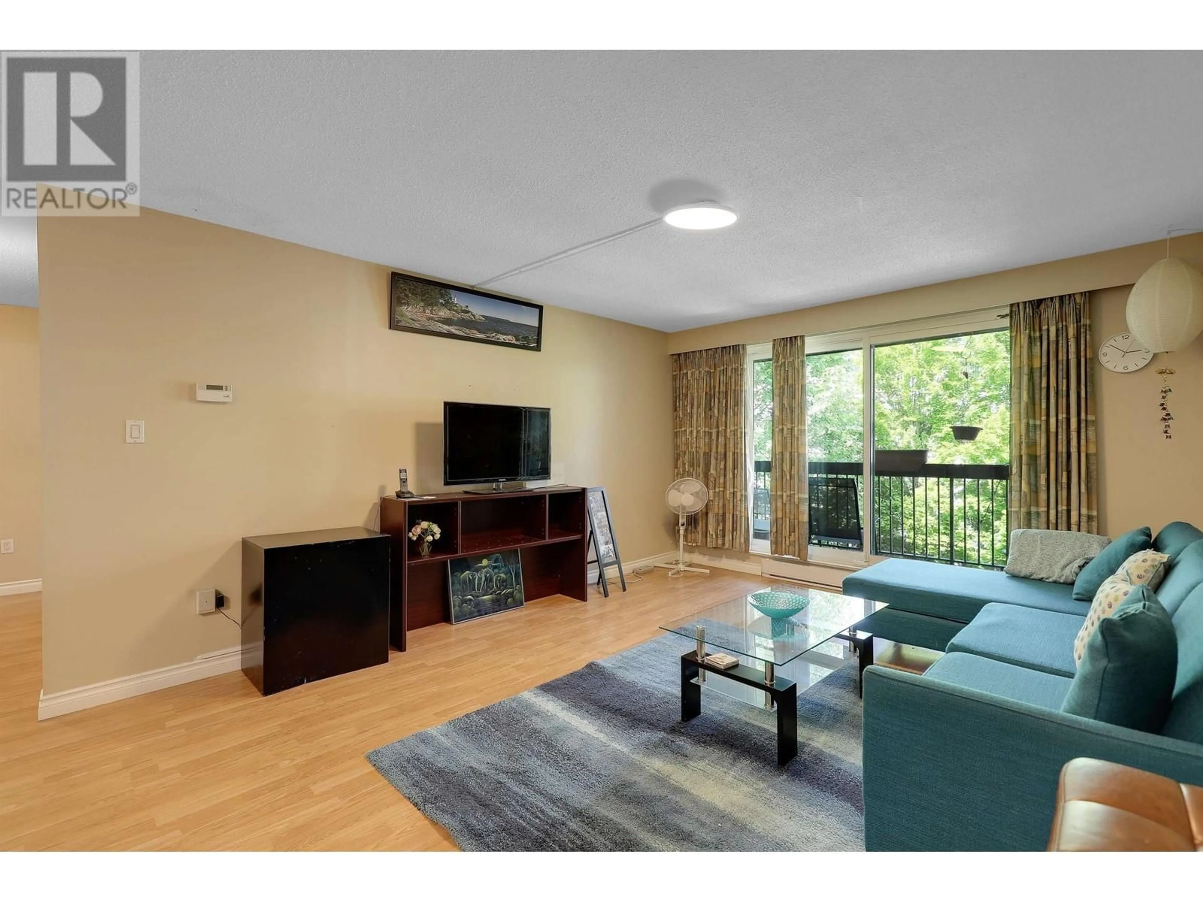Living room with furniture, wood/laminate floor for 308 - 2381 BURY AVENUE, Port Coquitlam British Columbia V3C1Z9