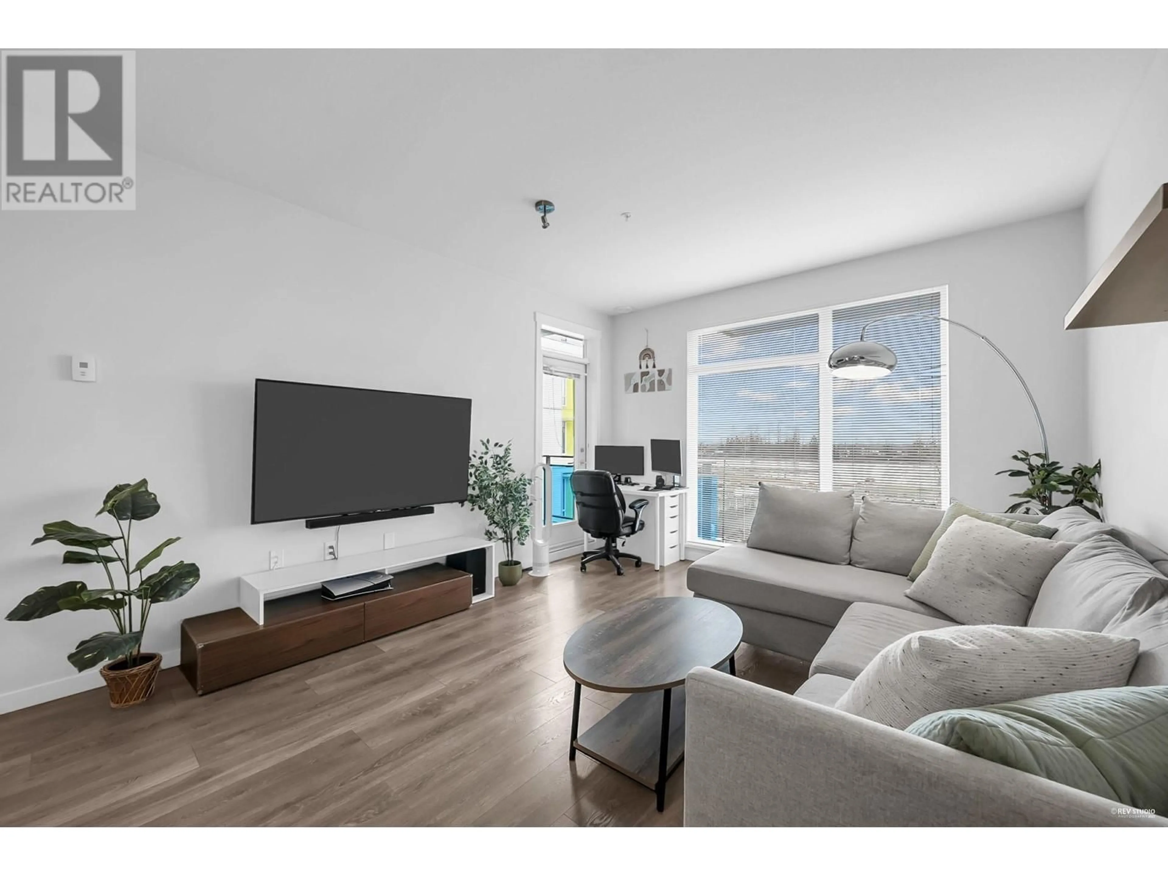 Living room with furniture, wood/laminate floor for 403 - 3289 RIVERWALK AVENUE, Vancouver British Columbia V5S0G2