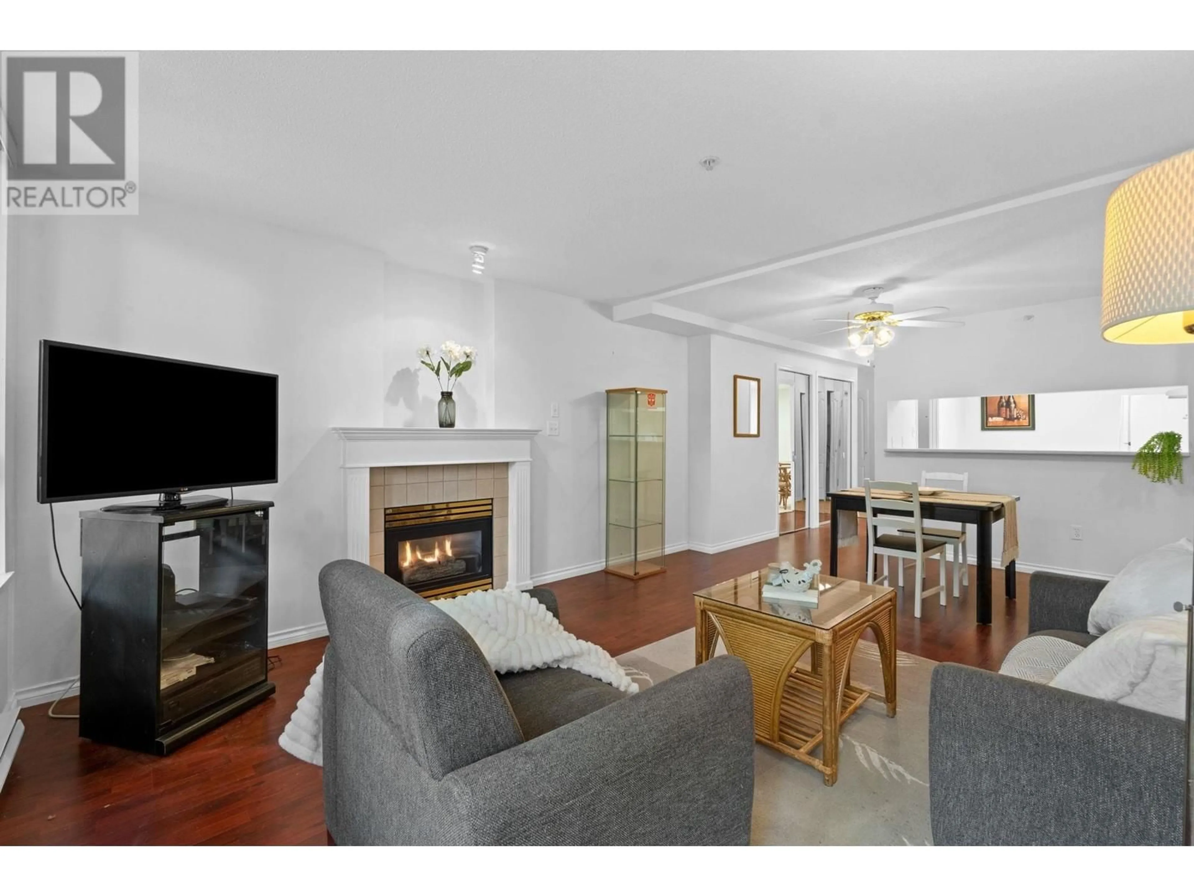 Living room with furniture, wood/laminate floor for 107 - 1196 PIPELINE ROAD, Coquitlam British Columbia V3B7Z6