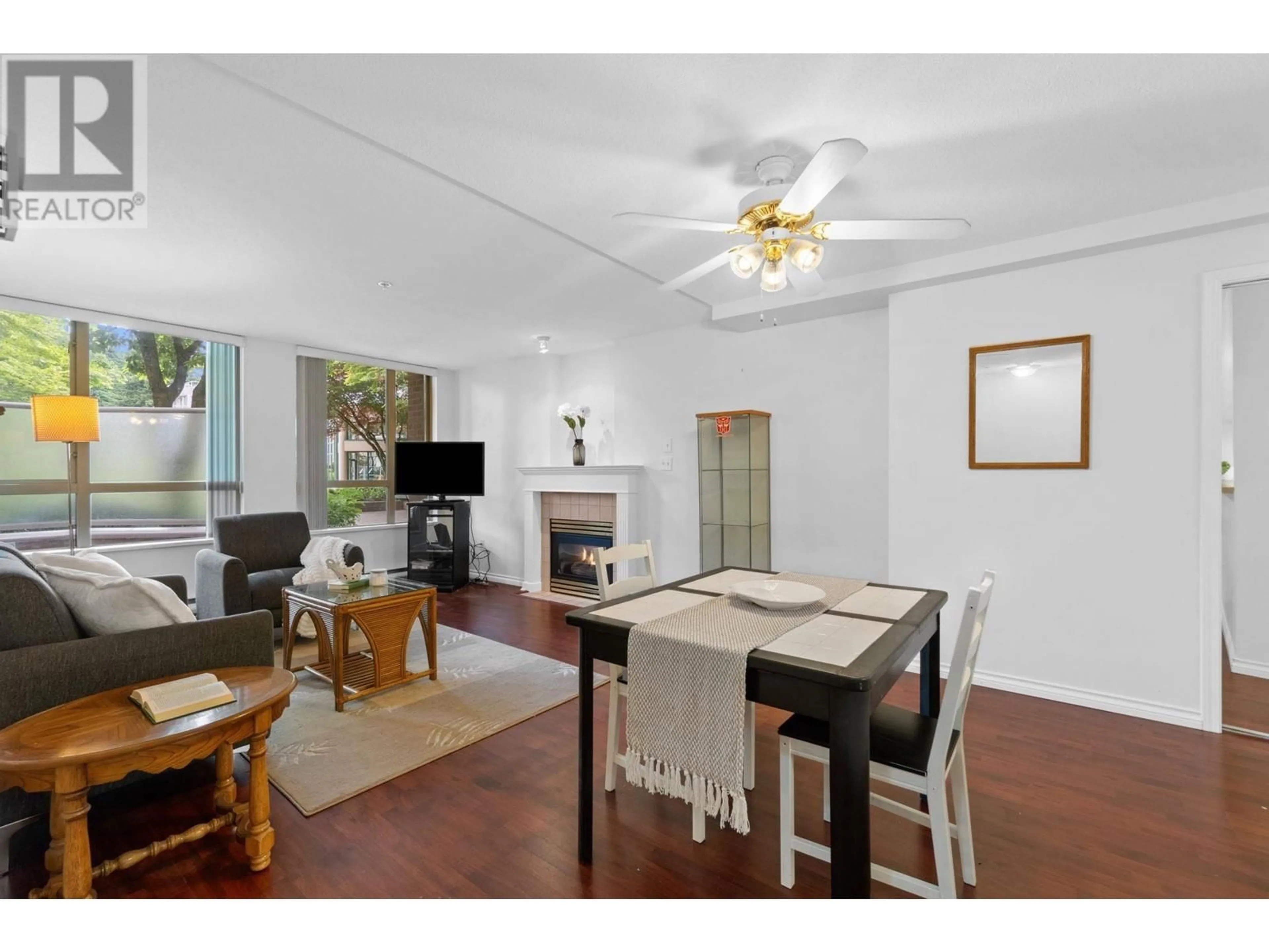 Living room with furniture, wood/laminate floor for 107 - 1196 PIPELINE ROAD, Coquitlam British Columbia V3B7Z6