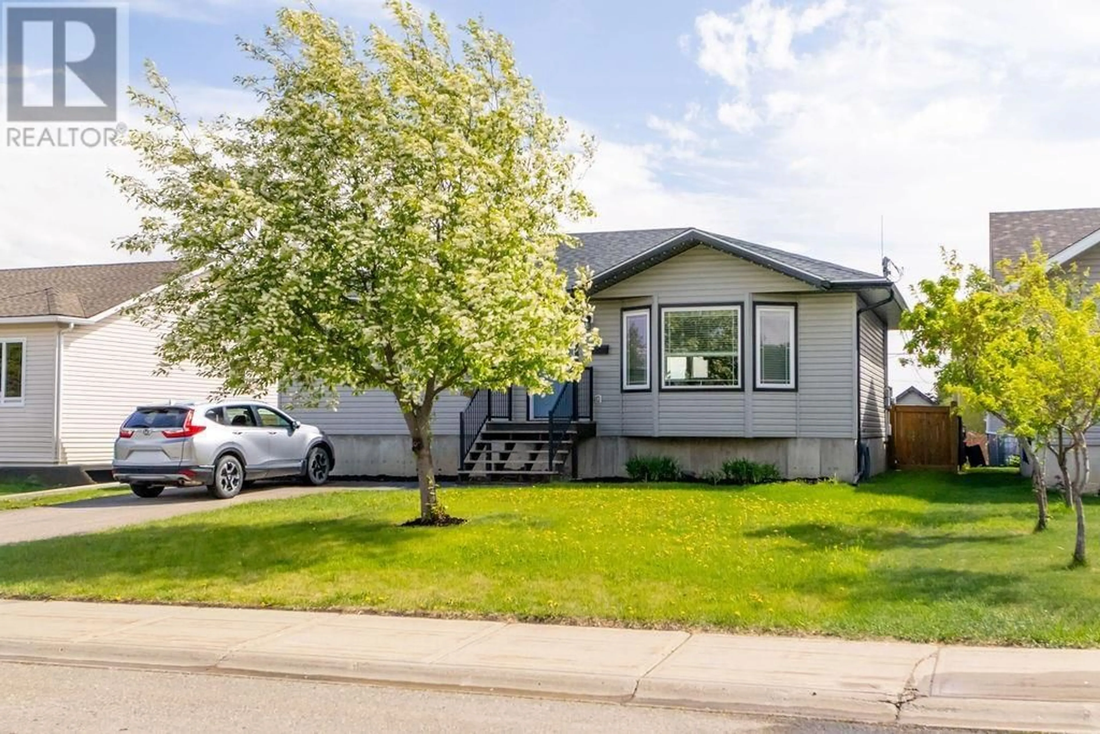 Home with vinyl exterior material, street for 7919 95 AVENUE, Fort St. John British Columbia V1J1G5