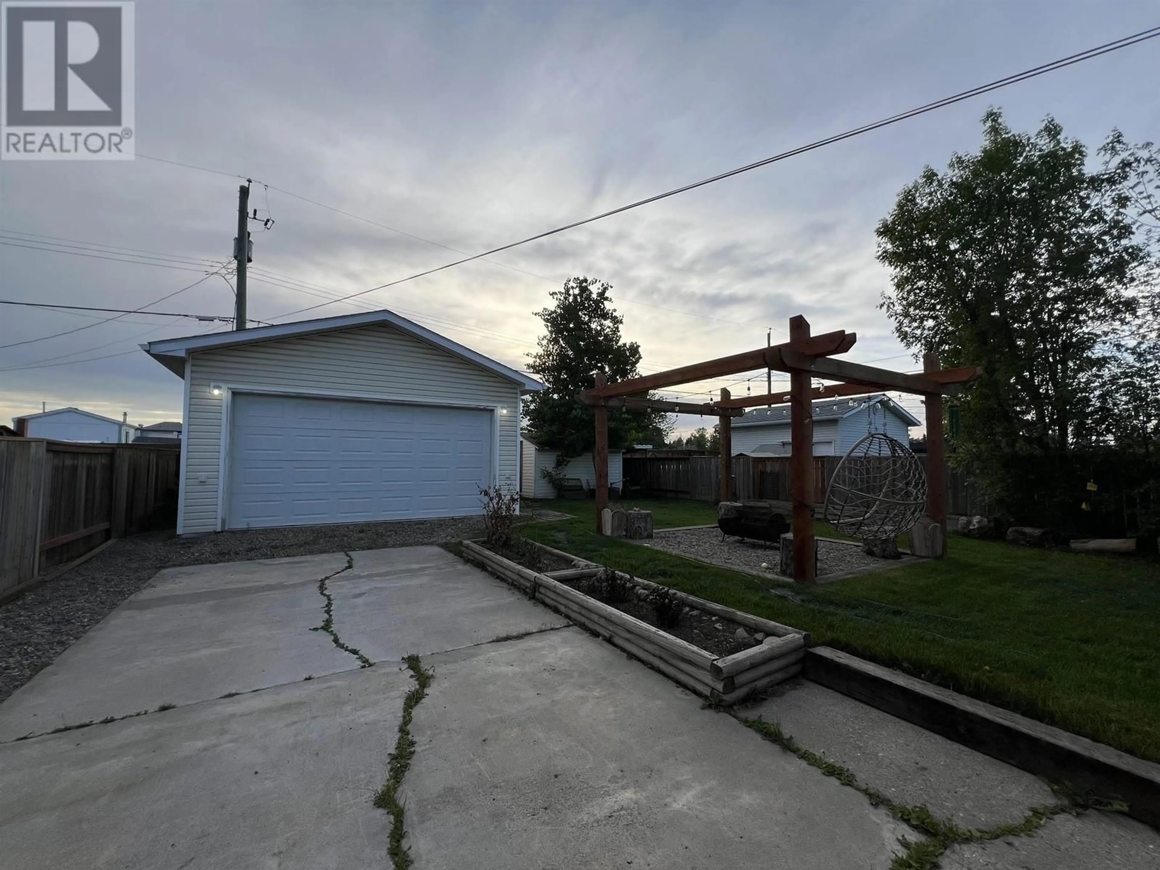 A pic from outside/outdoor area/front of a property/back of a property/a pic from drone, street for 9216 78A STREET, Fort St. John British Columbia V1J3B6