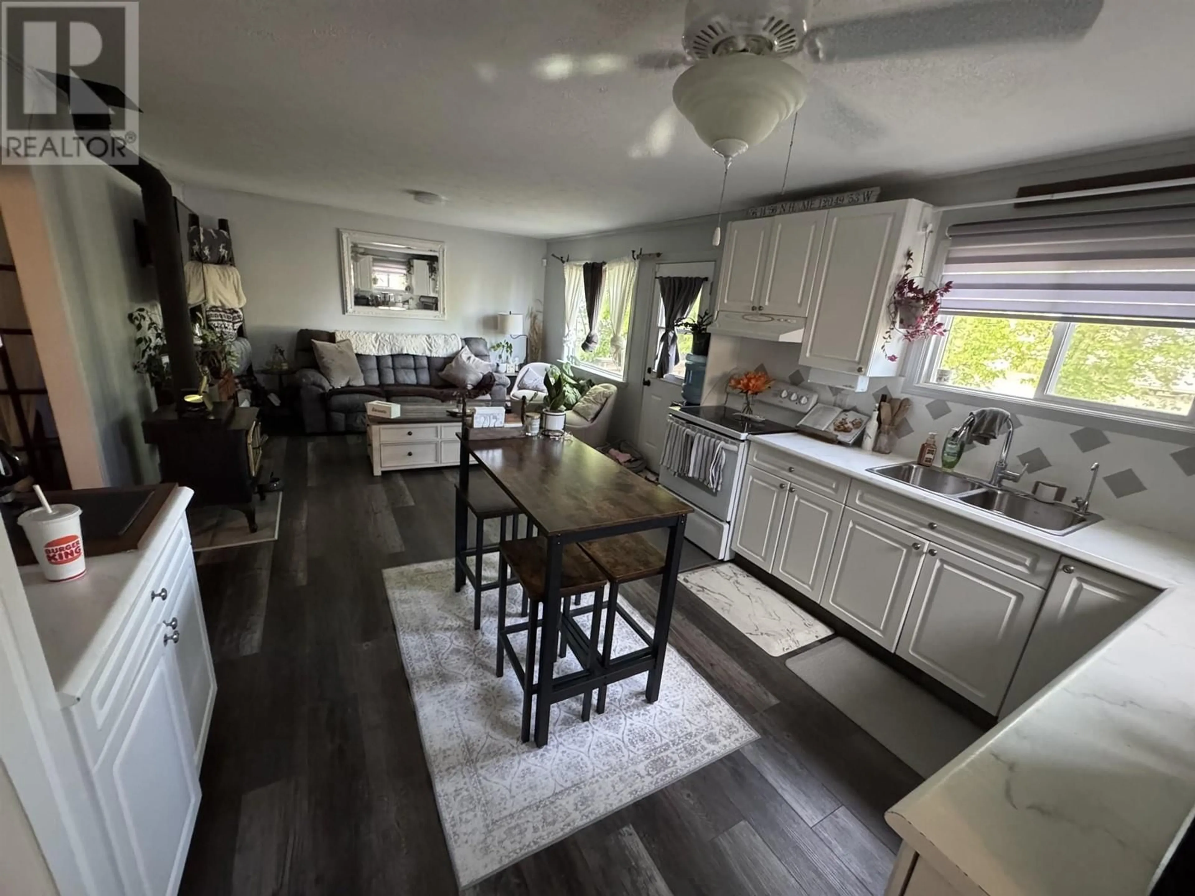 Open concept kitchen, wood/laminate floor for 9216 78A STREET, Fort St. John British Columbia V1J3B6