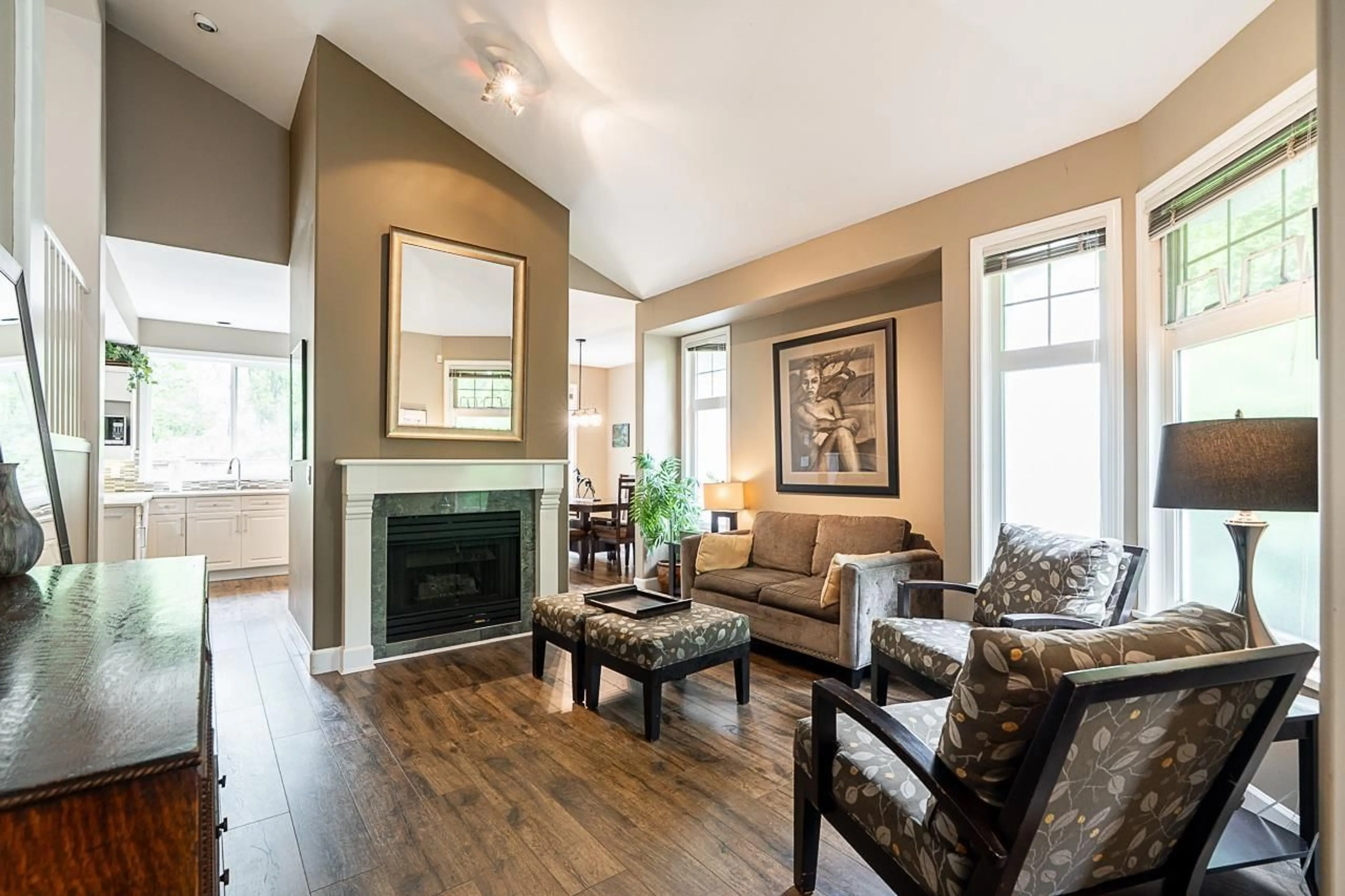 Living room with furniture, wood/laminate floor for 7458 147A, Surrey British Columbia V3S8Y6
