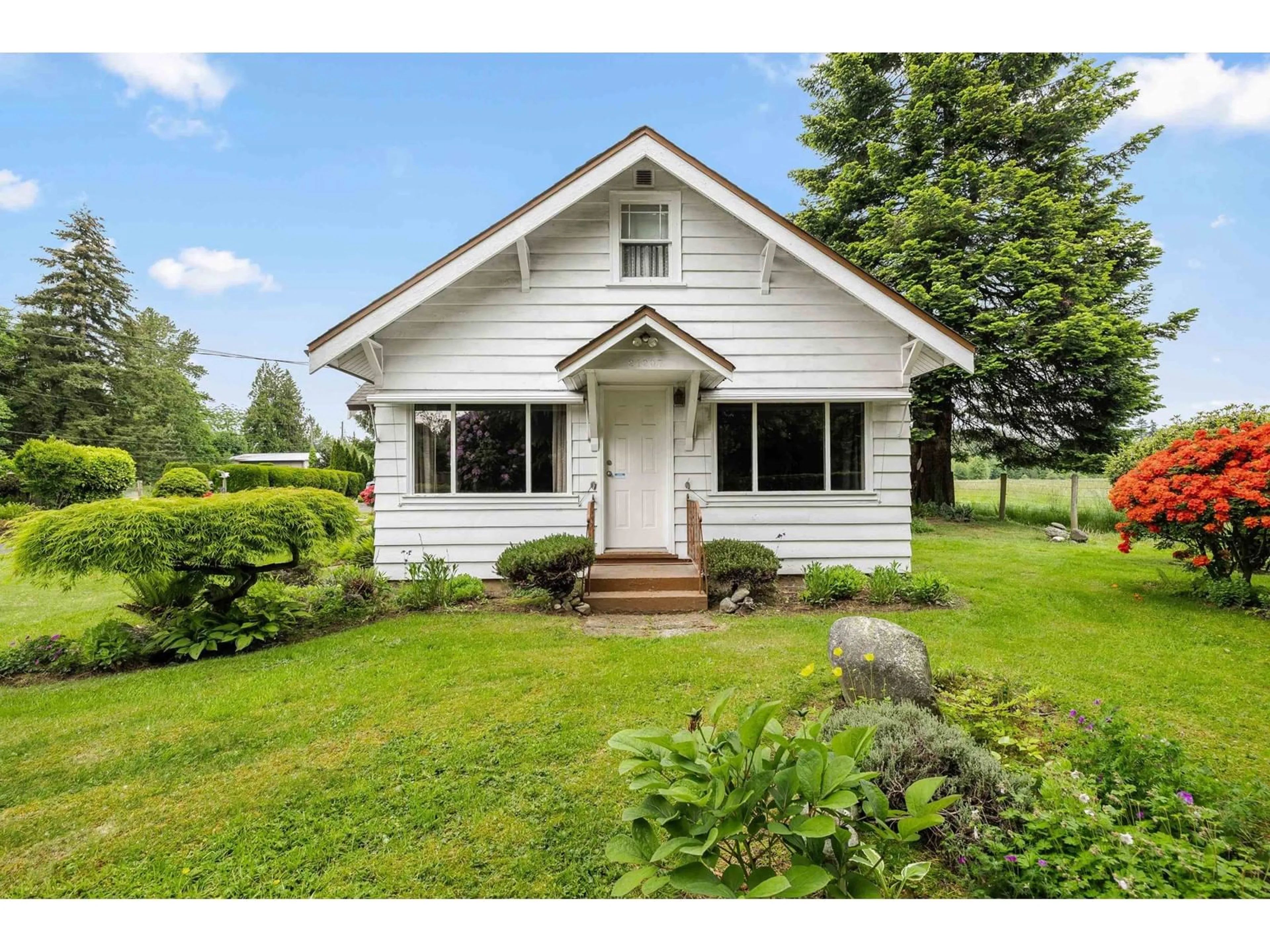 Home with vinyl exterior material, street for 21207 96, Langley British Columbia V1M2Z4
