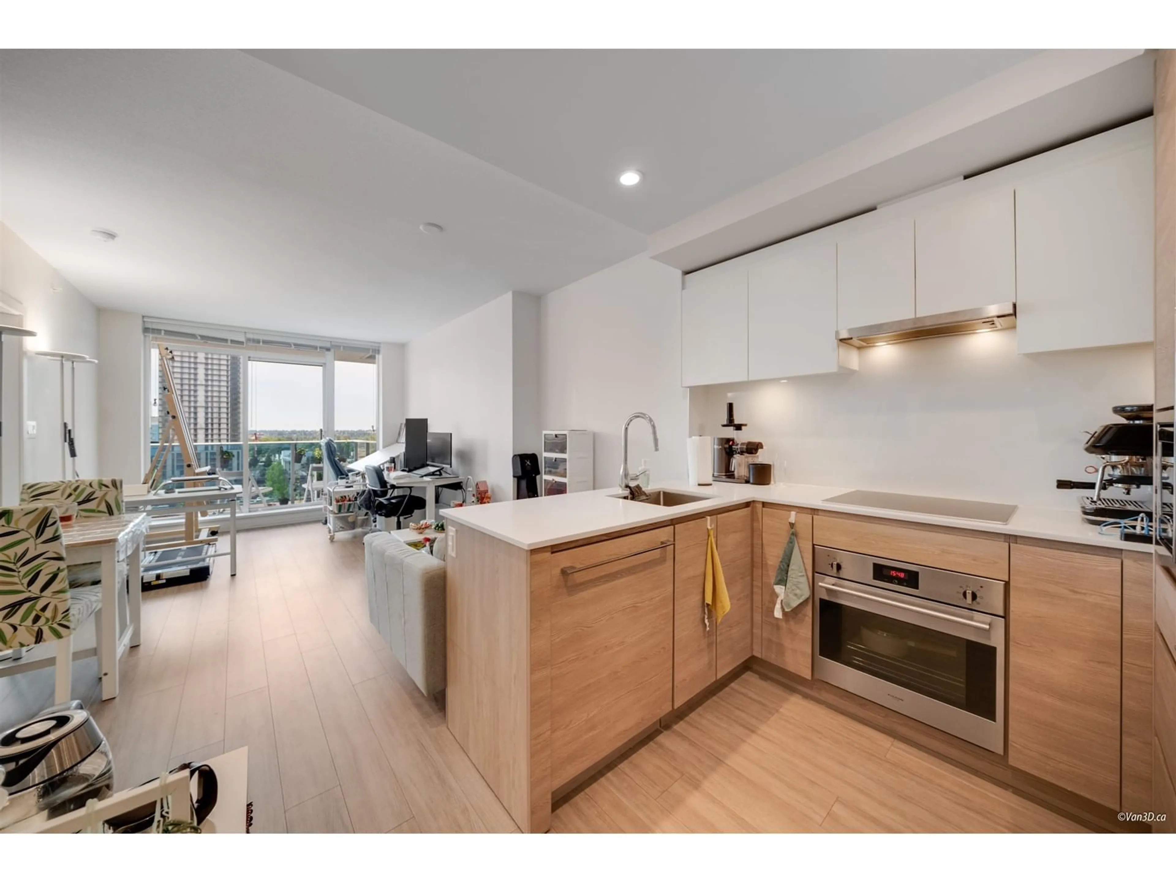 Open concept kitchen, wood/laminate floor for 711 - 13615 FRASER, Surrey British Columbia V3T0P7