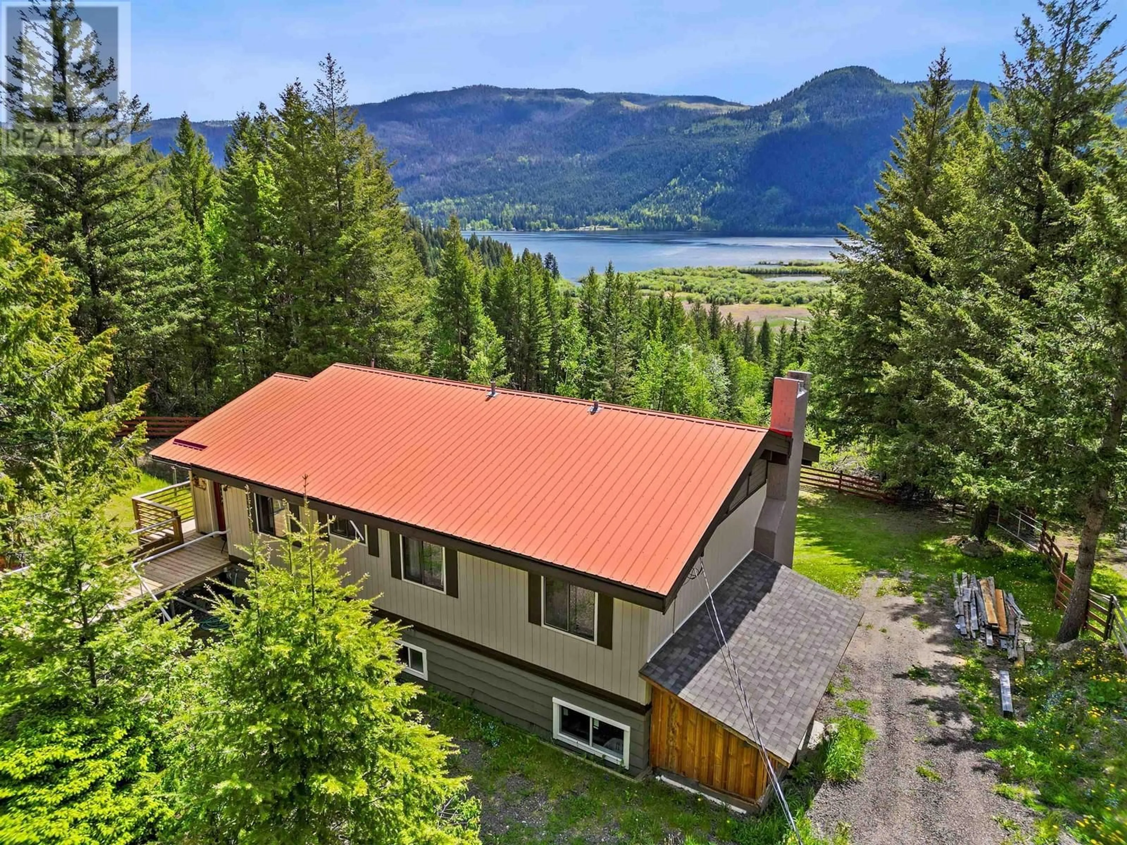 A pic from outside/outdoor area/front of a property/back of a property/a pic from drone, water/lake/river/ocean view for 7267 SUMMIT DRIVE, Canim Lake British Columbia V0K1J0