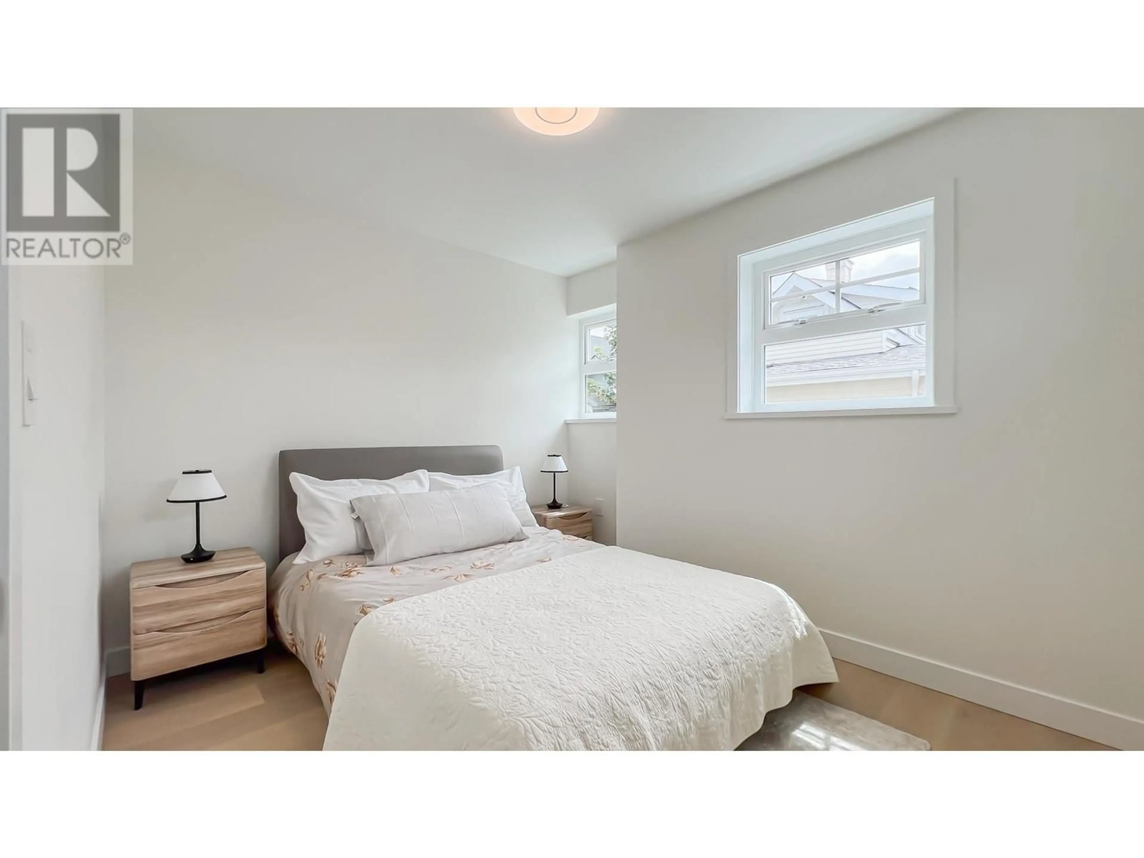 Bedroom with bed, wood/laminate floor for 1155 KEEFER STREET, Vancouver British Columbia V6A1Z2