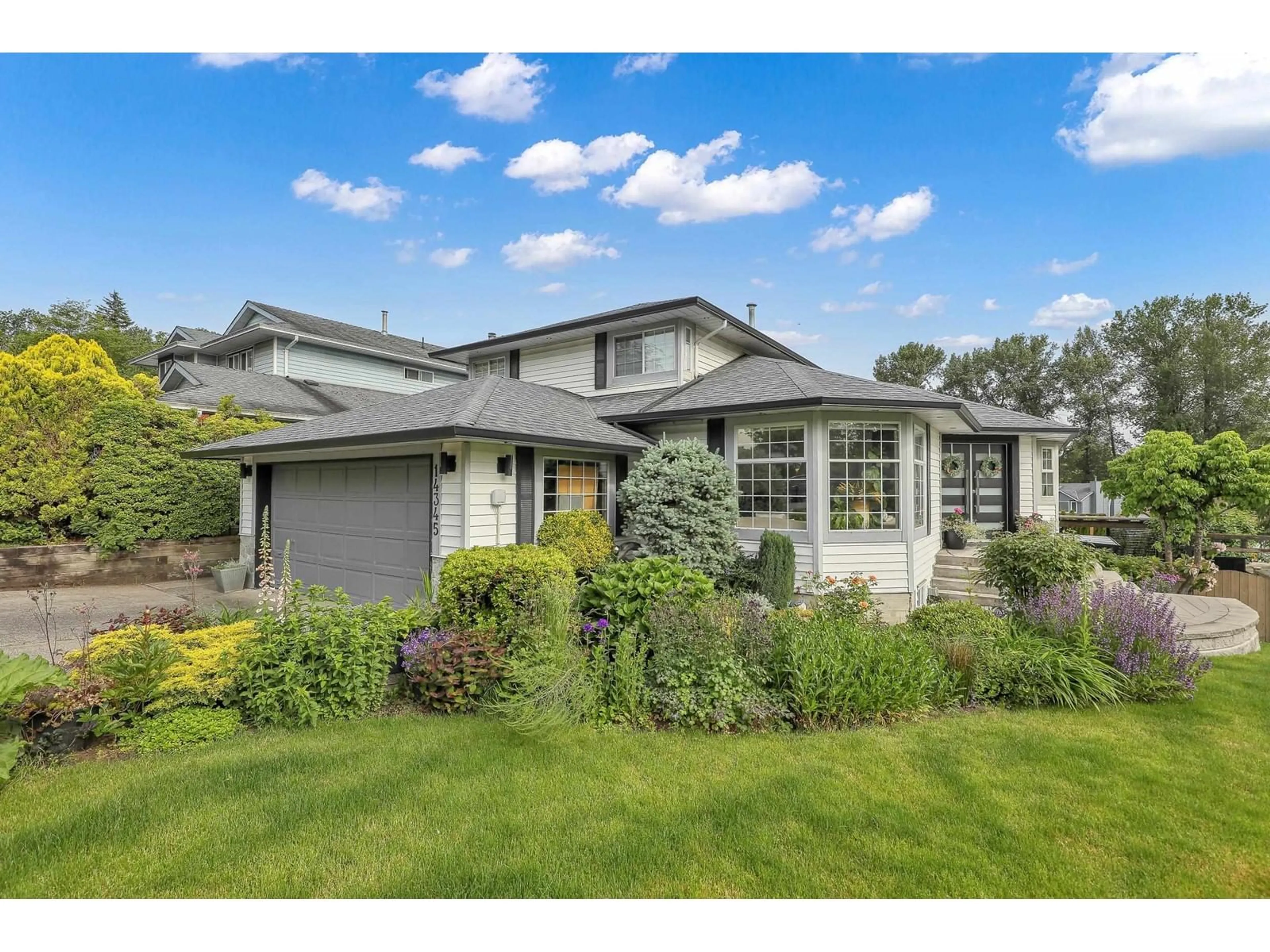 Home with vinyl exterior material, street for 14345 78A, Surrey British Columbia V3W9W3