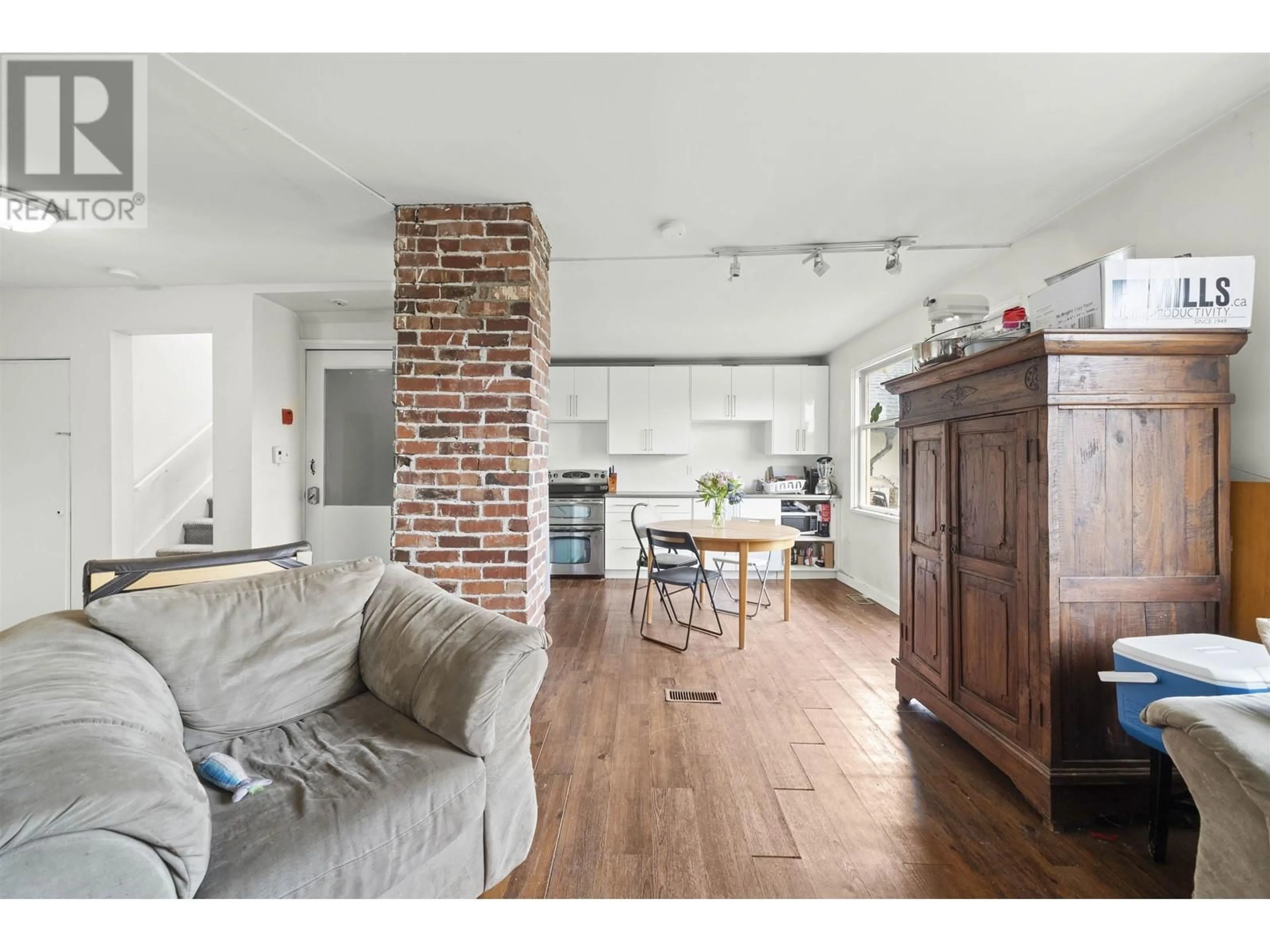 Open concept kitchen, wood/laminate floor for 3550 1ST AVENUE, Vancouver British Columbia V6R1G8