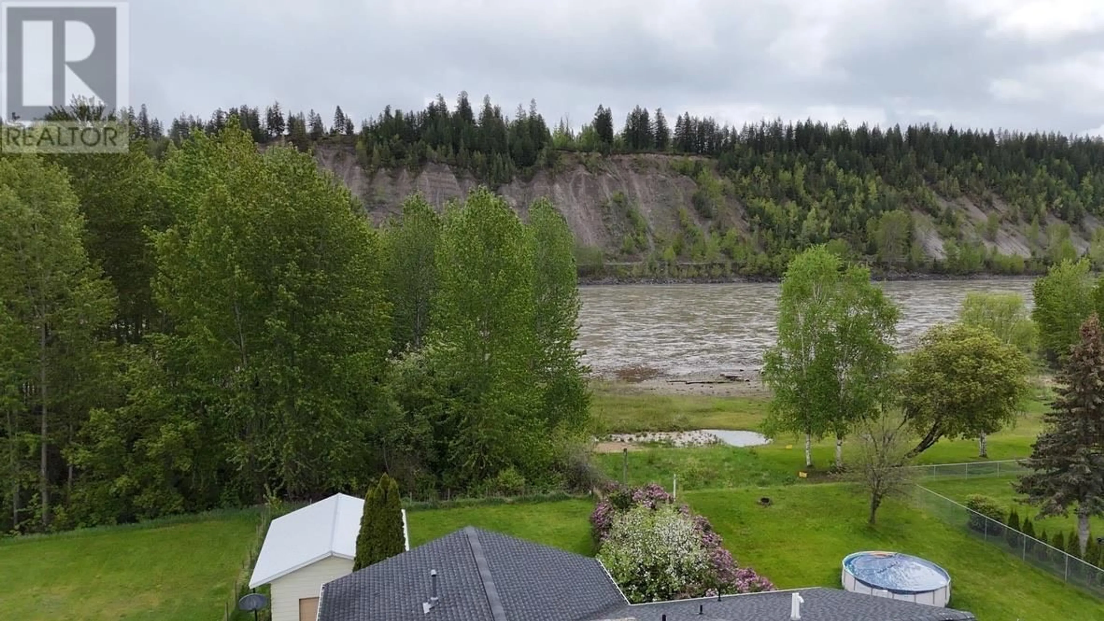 A pic from outside/outdoor area/front of a property/back of a property/a pic from drone, water/lake/river/ocean view for 772 ROLPH STREET, Quesnel British Columbia V2J3M1