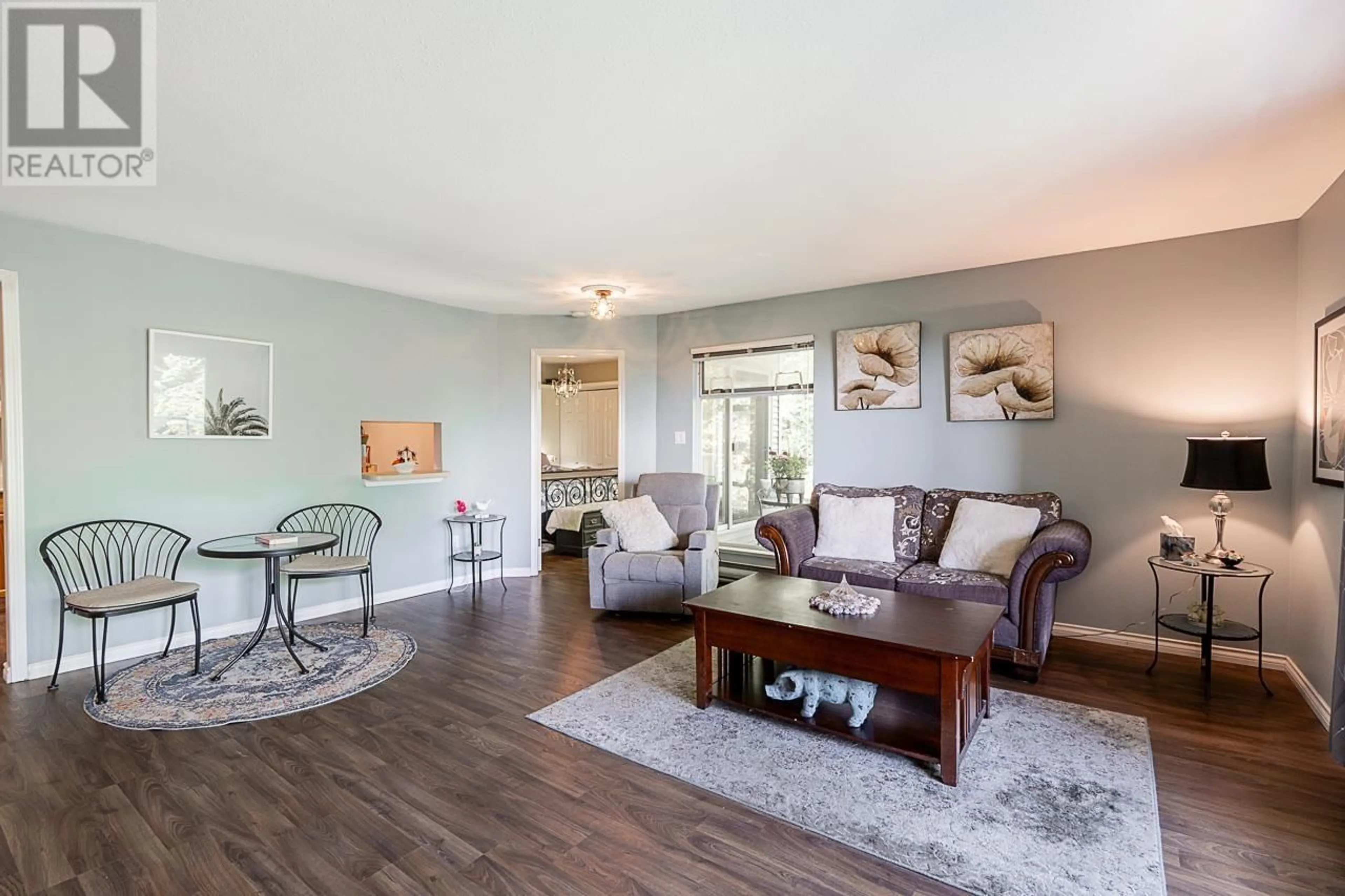 Living room with furniture, wood/laminate floor for 308 - 2733 ATLIN PLACE, Coquitlam British Columbia V3C5B1