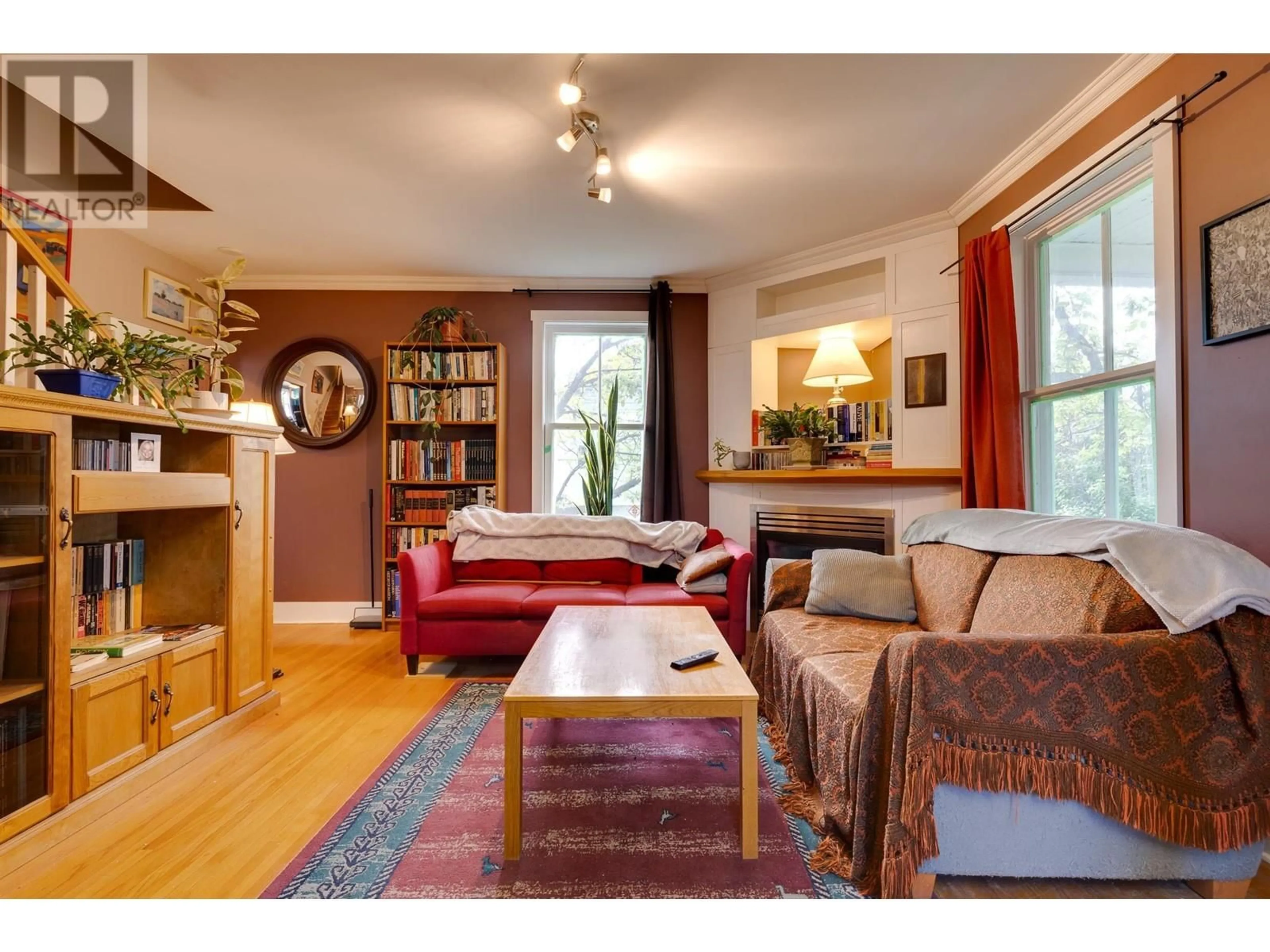 Living room with furniture, wood/laminate floor for 1684 5TH AVENUE, Prince George British Columbia V2L3M1
