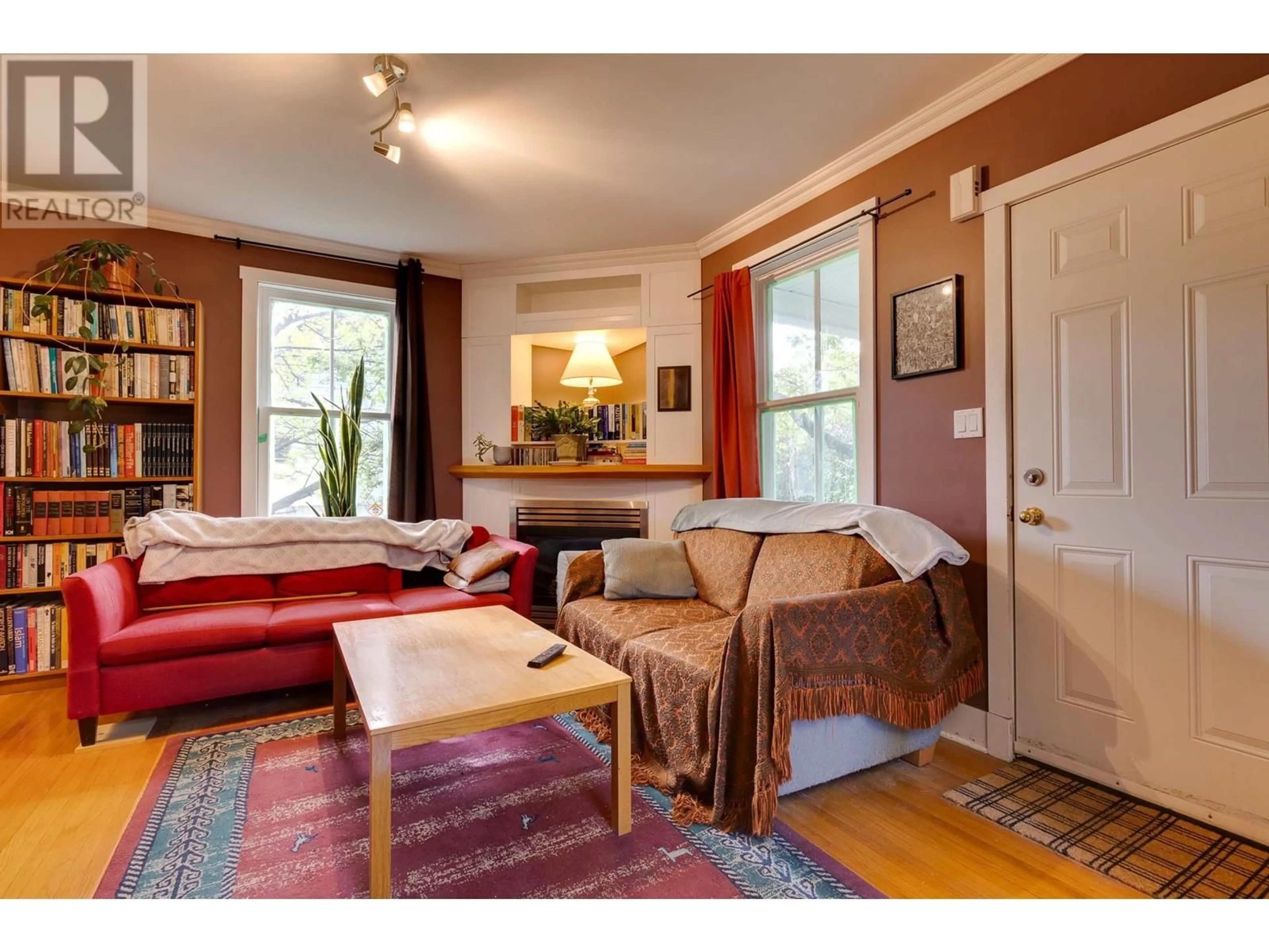 Living room with furniture, wood/laminate floor for 1684 5TH AVENUE, Prince George British Columbia V2L3M1