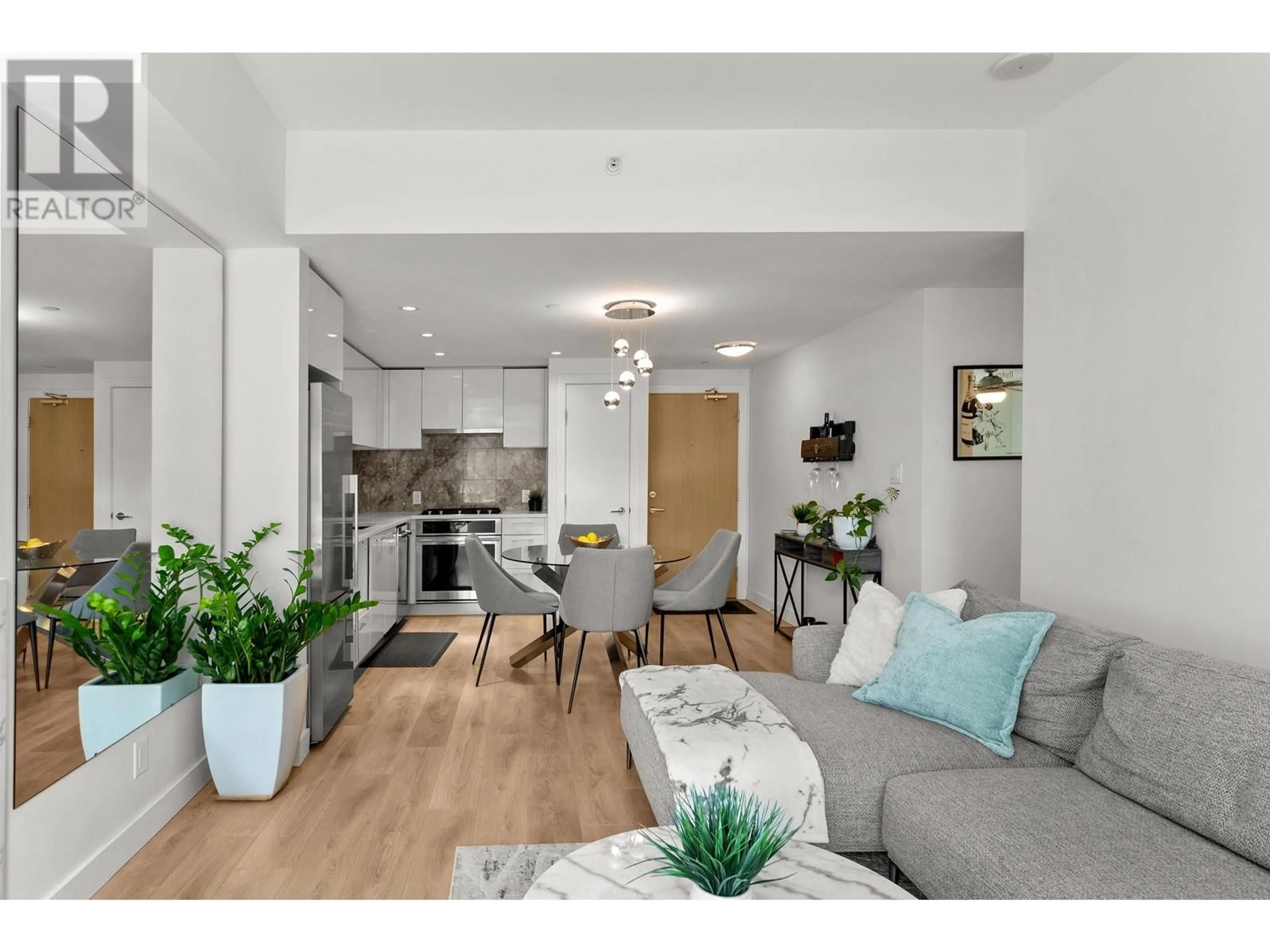 Living room with furniture, wood/laminate floor for 205 - 3557 SAWMILL CRESCENT, Vancouver British Columbia V5S0E2