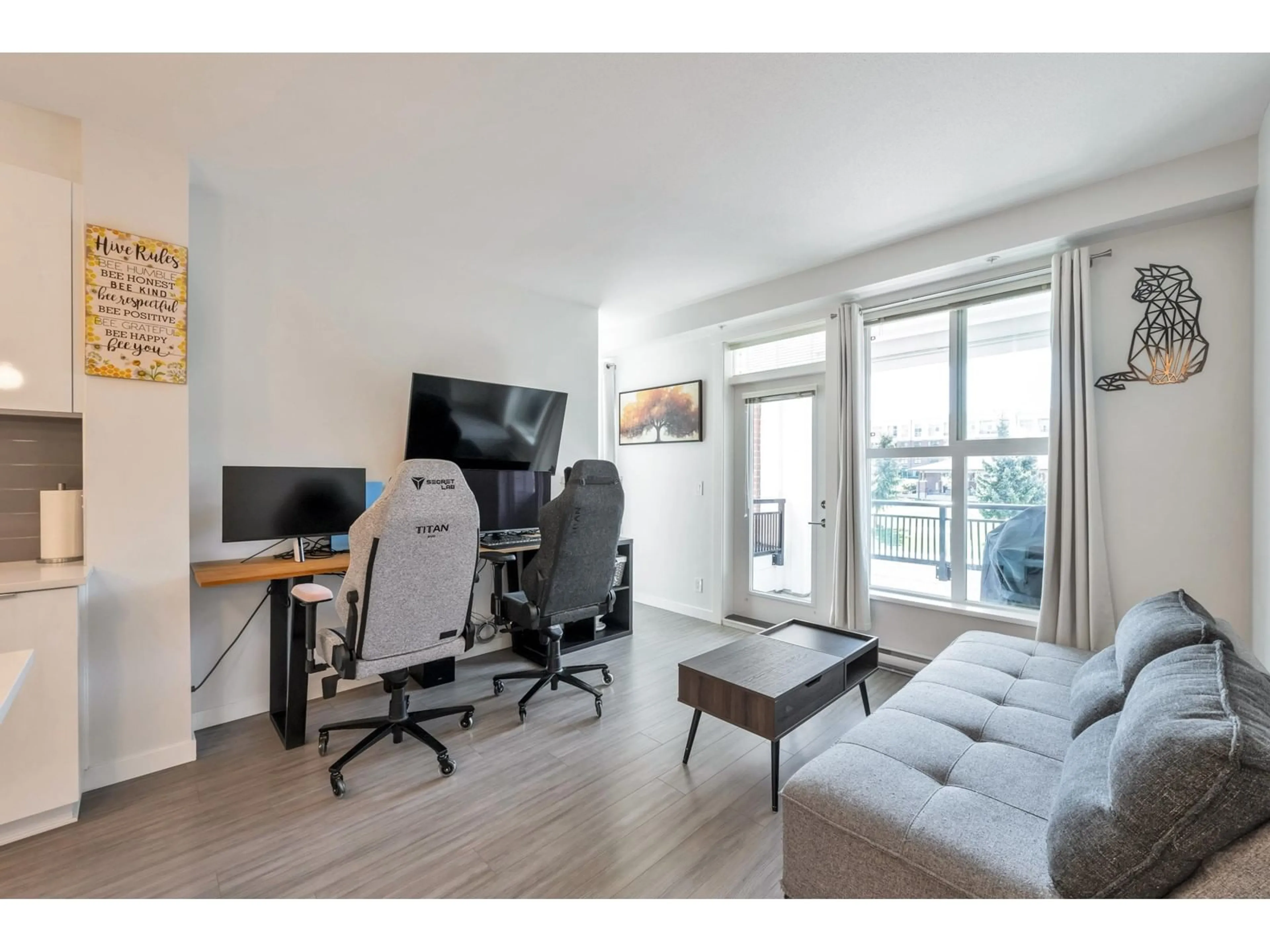 Living room with furniture, wood/laminate floor for B222 - 8150 207, Langley British Columbia V2Y4J3