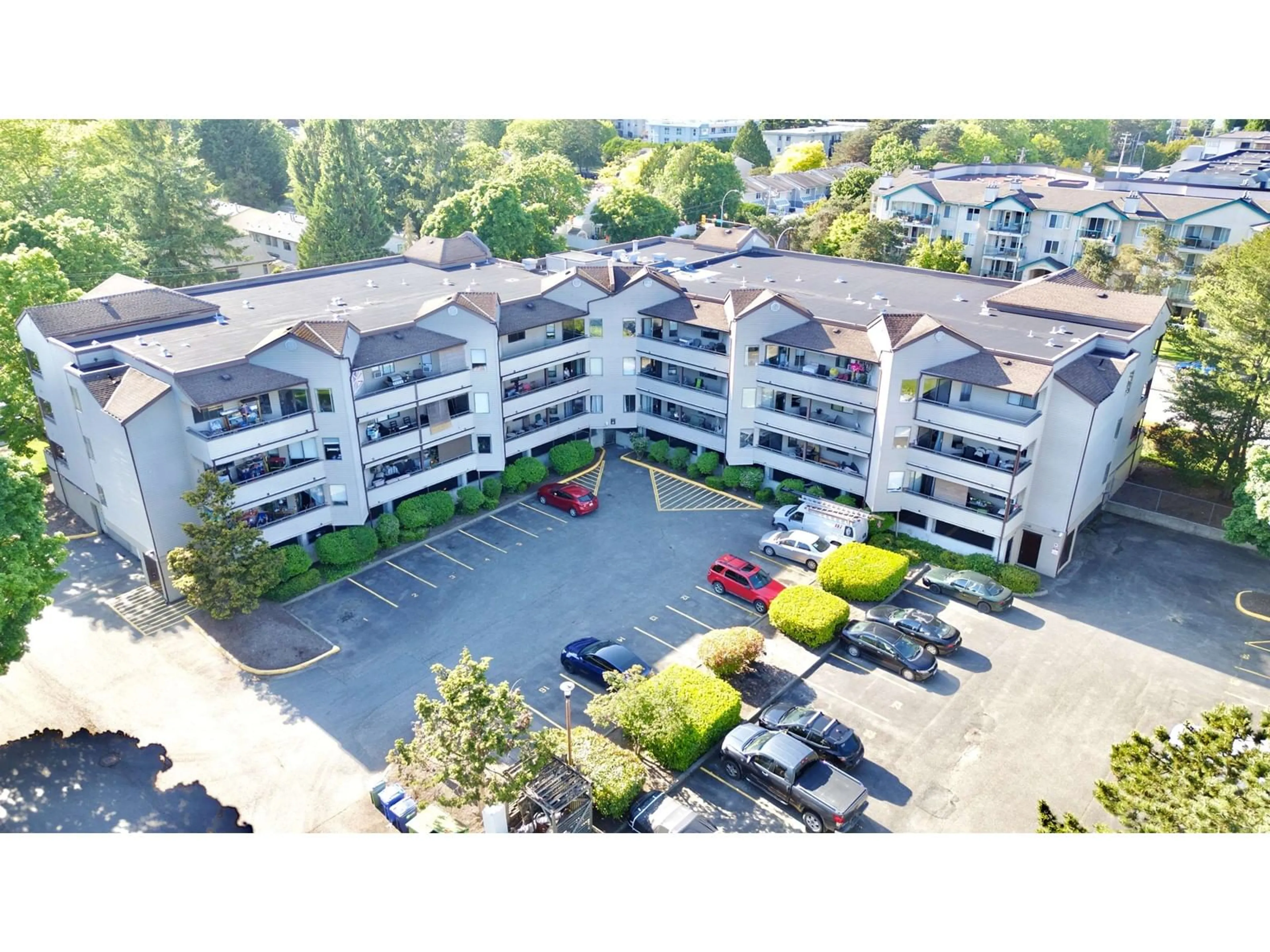 A pic from outside/outdoor area/front of a property/back of a property/a pic from drone, building for 307 - 5294 204, Langley British Columbia V3A1Z1