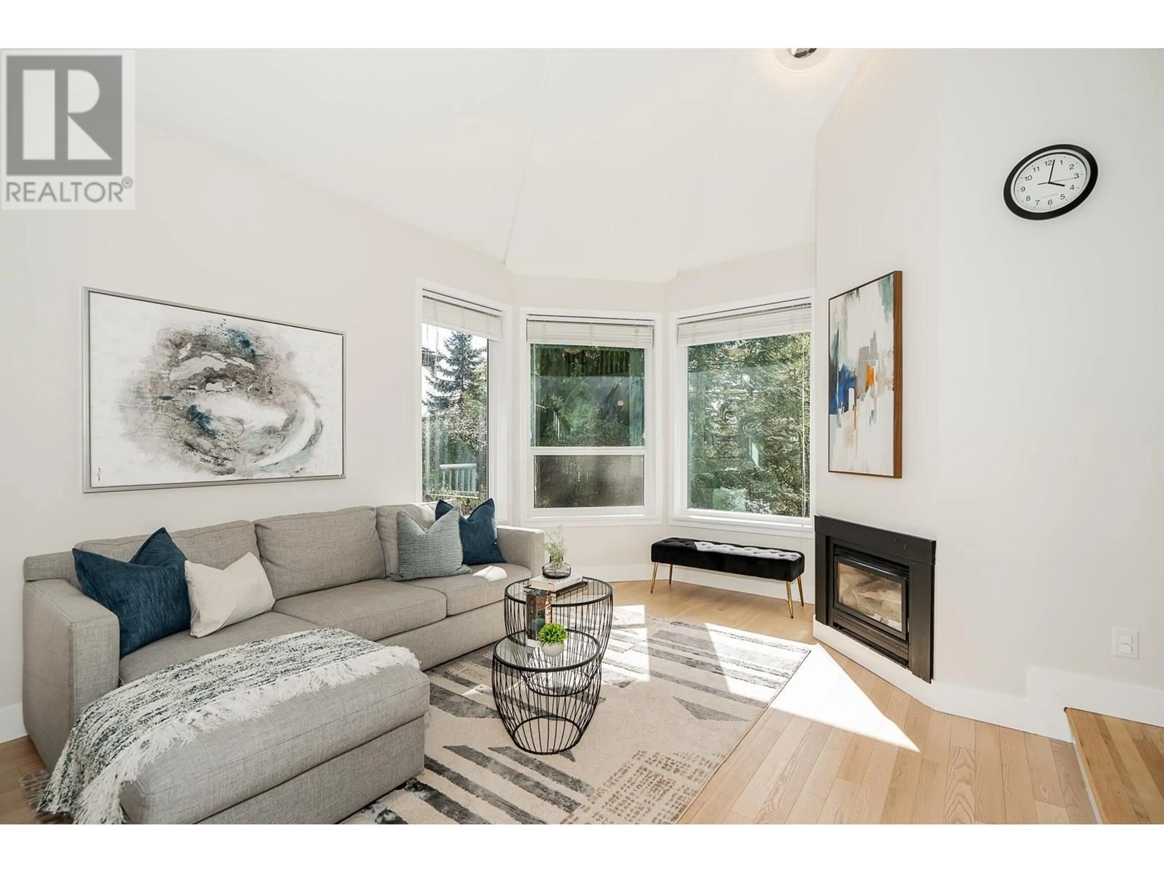 Living room with furniture, wood/laminate floor for 12 FLAVELLE DRIVE, Port Moody British Columbia V3H4L4