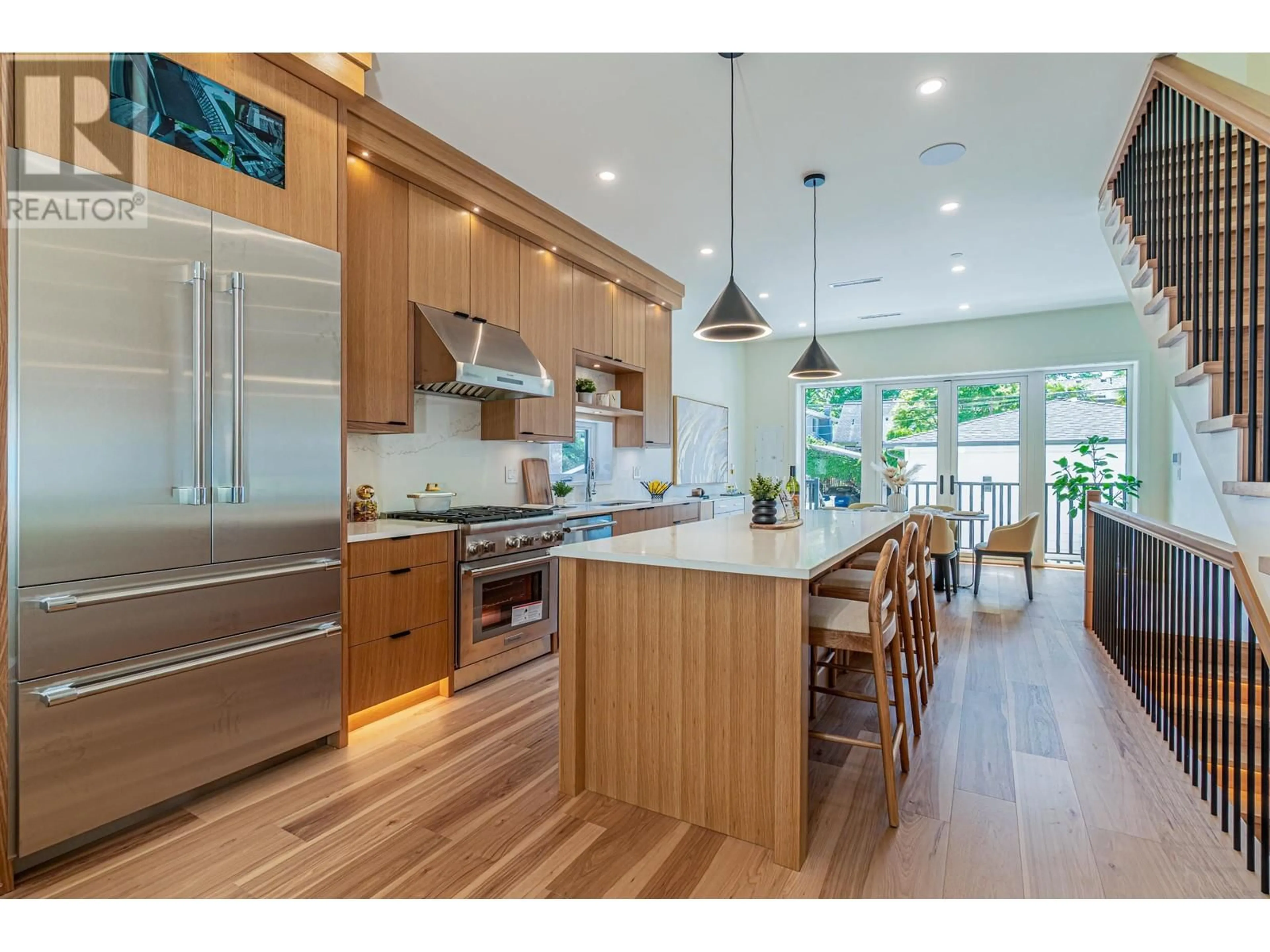 Open concept kitchen, wood/laminate floor for 3338 14TH AVENUE, Vancouver British Columbia V6R2V8
