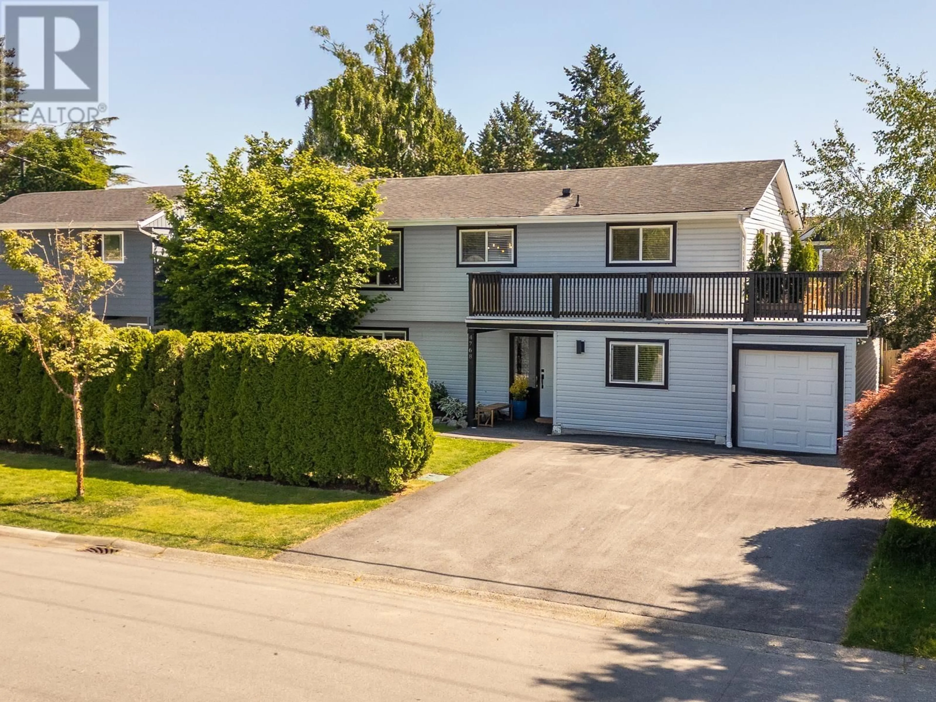 A pic from outside/outdoor area/front of a property/back of a property/a pic from drone, street for 4768 45 AVENUE, Delta British Columbia V4K1J8