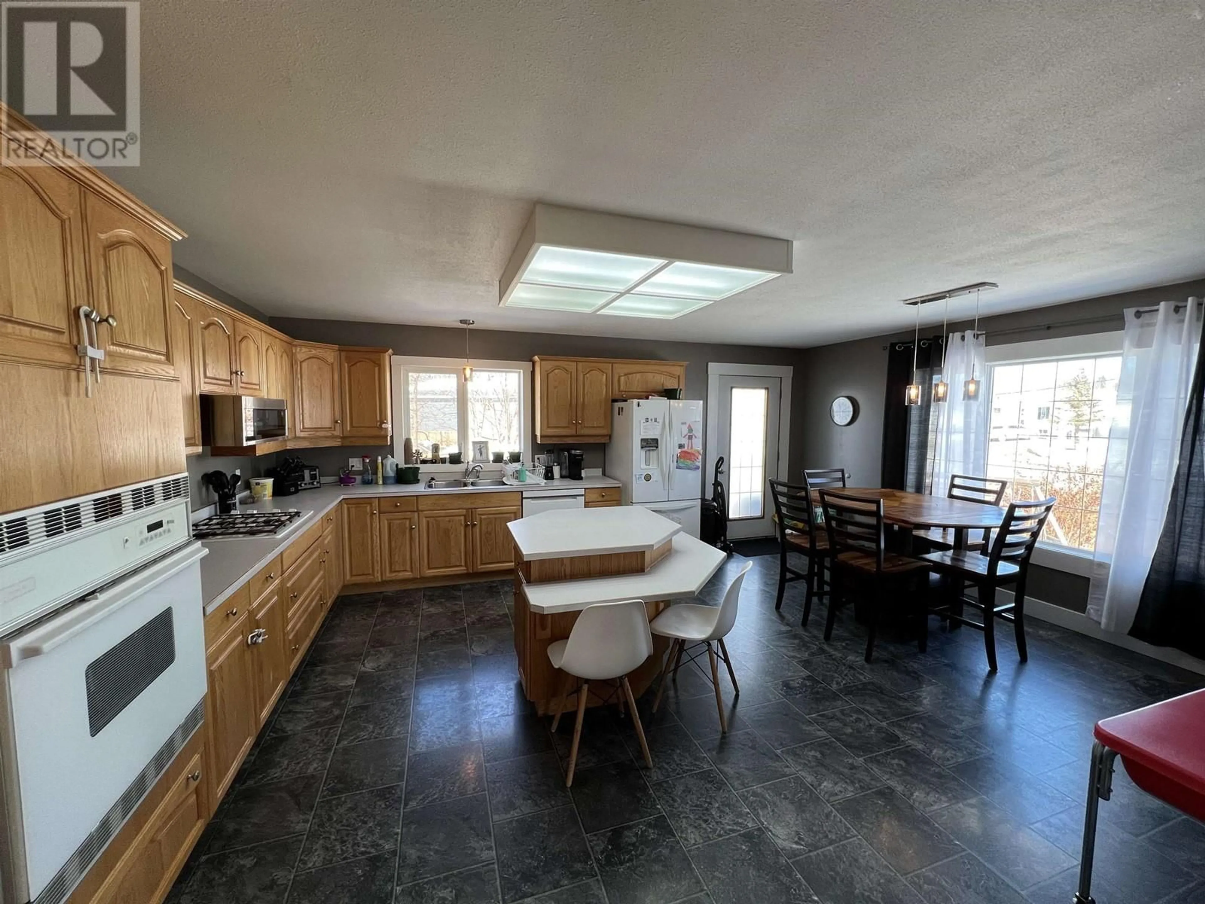 Open concept kitchen, ceramic/tile floor for 3912 COTTONWOOD ROAD, Fort Nelson British Columbia V0C1R0