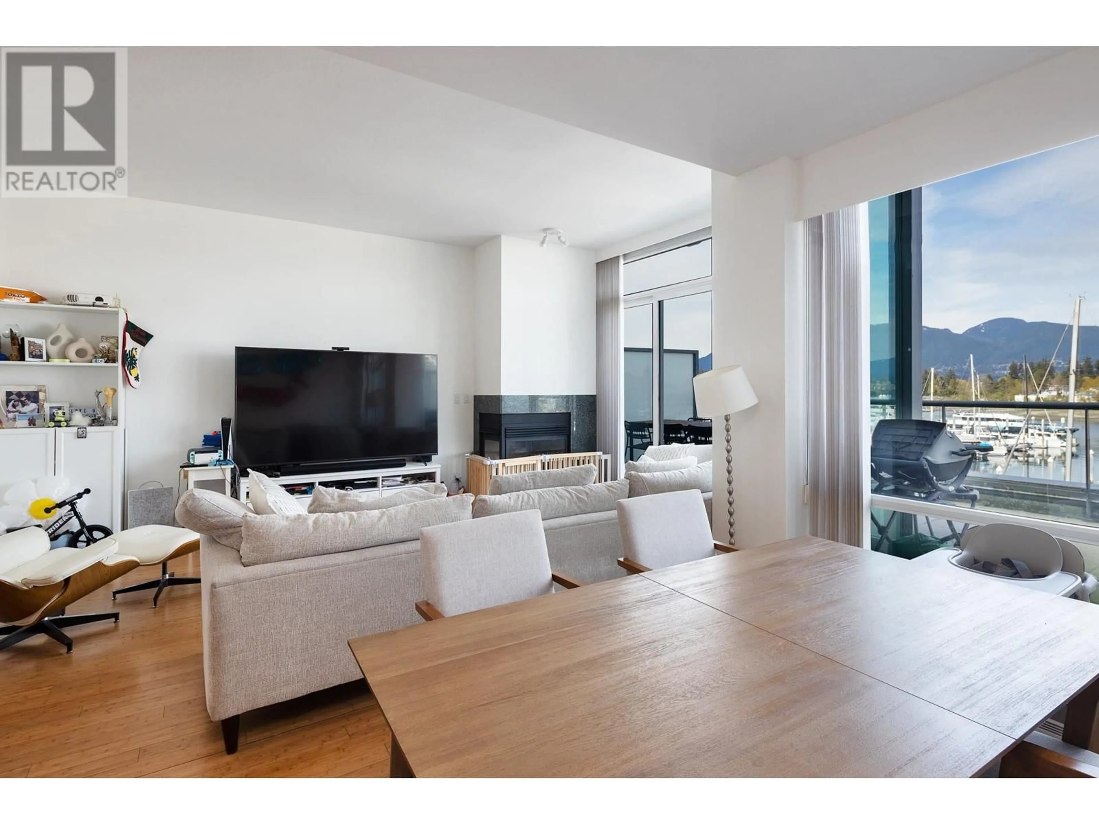 Living room with furniture, wood/laminate floor for 211 - 560 NICOLA STREET, Vancouver British Columbia V6G3J7