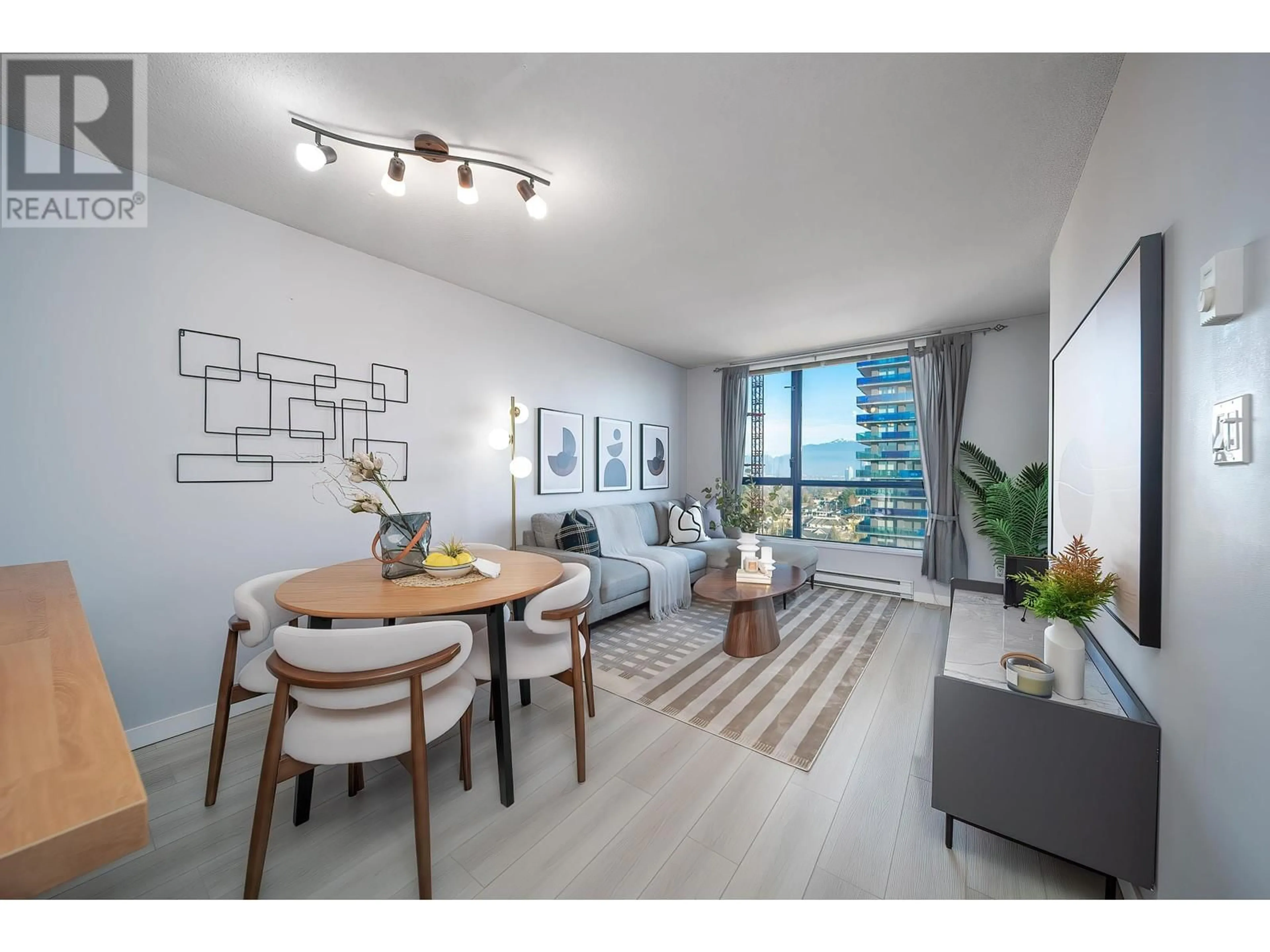 Living room with furniture, wood/laminate floor for 1606 - 3438 VANNESS AVENUE, Vancouver British Columbia V5R6E7