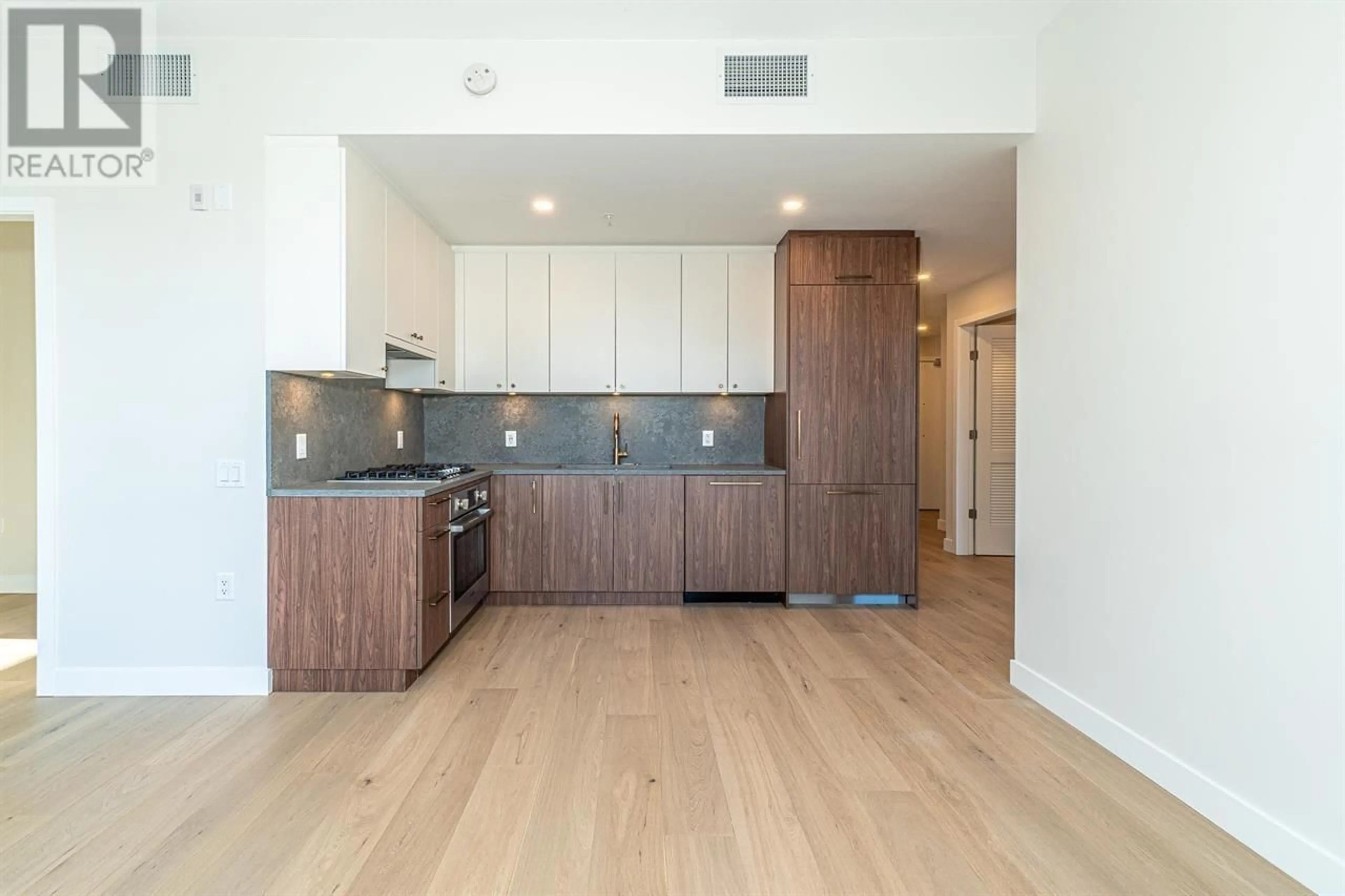 Open concept kitchen, wood/laminate floor for 209 - 5007 ASH STREET, Vancouver British Columbia V5Z0K9