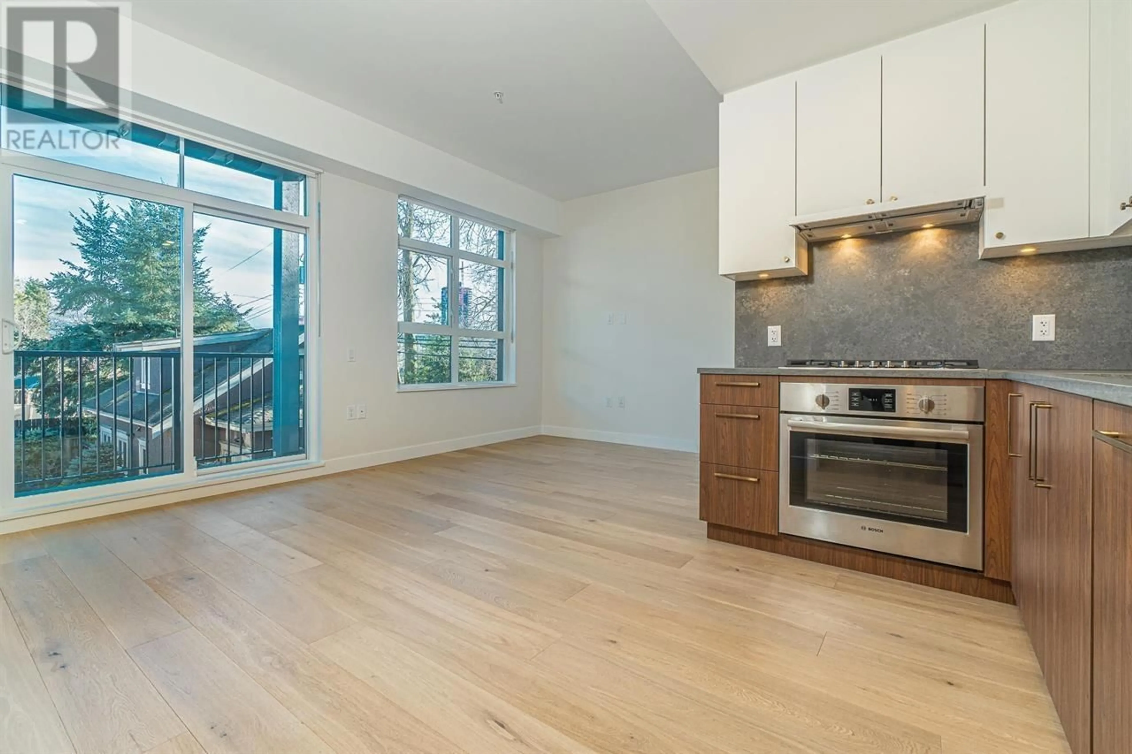 Open concept kitchen, wood/laminate floor for 209 - 5007 ASH STREET, Vancouver British Columbia V5Z0K9
