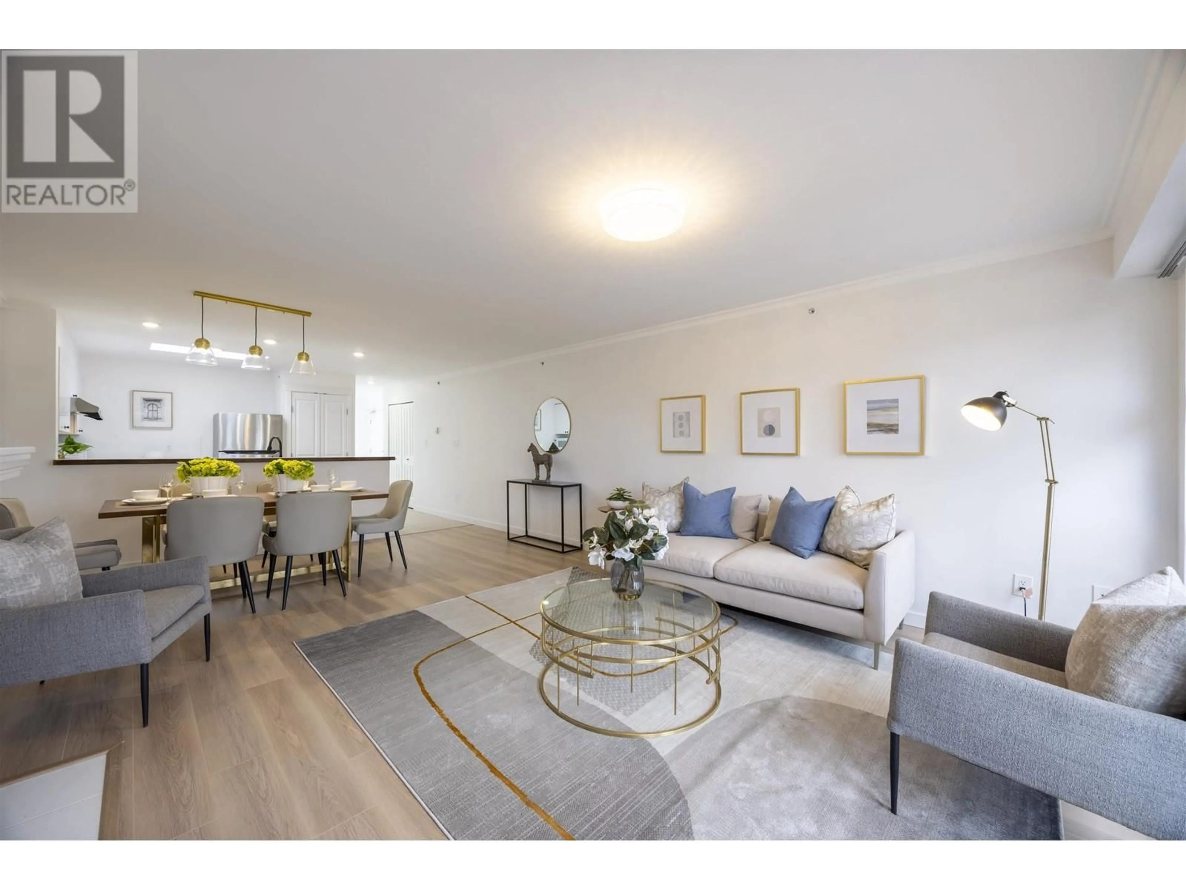 Living room with furniture, wood/laminate floor for 409 - 3580 W 41TH AVENUE, Vancouver British Columbia V6N3E6