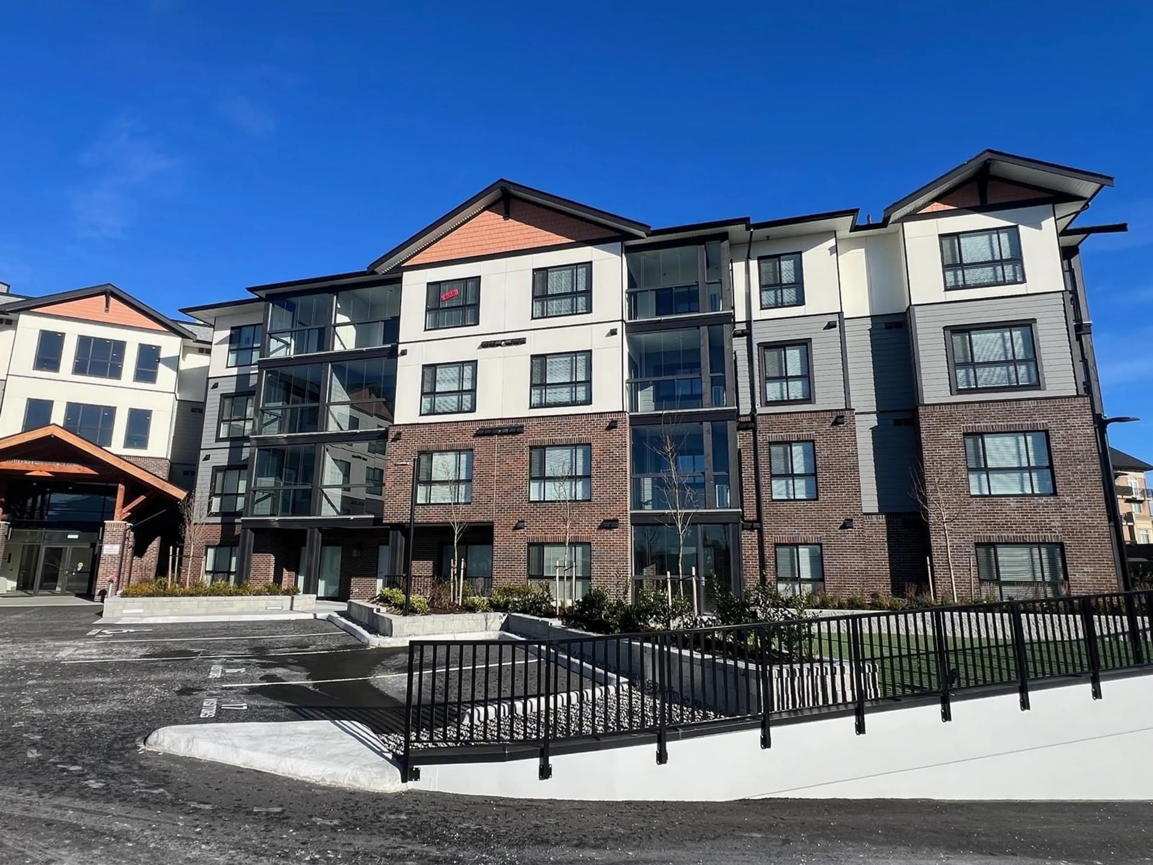 A pic from outside/outdoor area/front of a property/back of a property/a pic from drone, unknown for 307 - 8497 YOUNG ROAD, Chilliwack British Columbia V2P4P2
