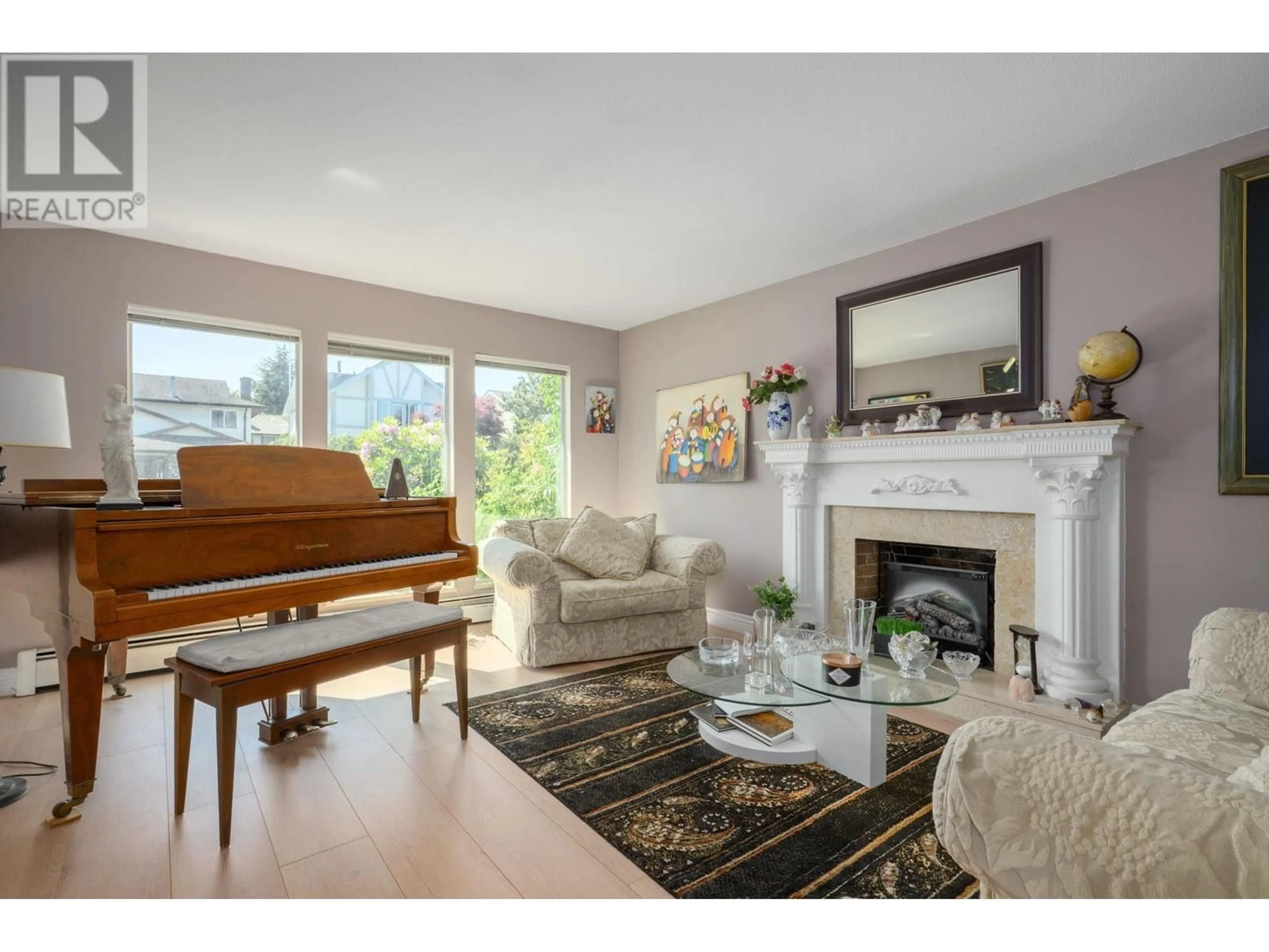 Living room with furniture, wood/laminate floor for 6571 DAKOTA DRIVE, Richmond British Columbia V7C4X5