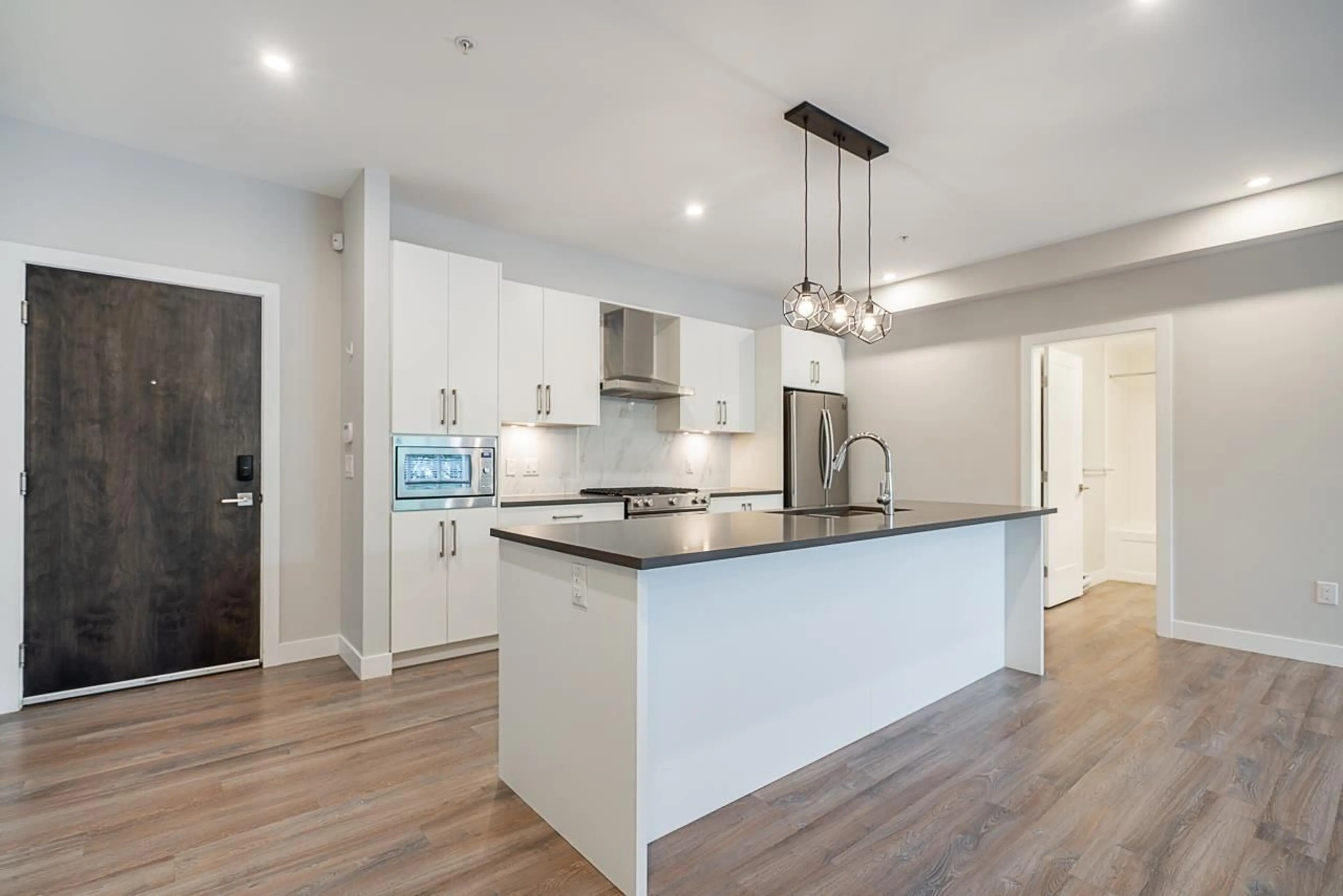 Open concept kitchen, unknown for 210 - 15436 31, Surrey British Columbia V3Z1H3