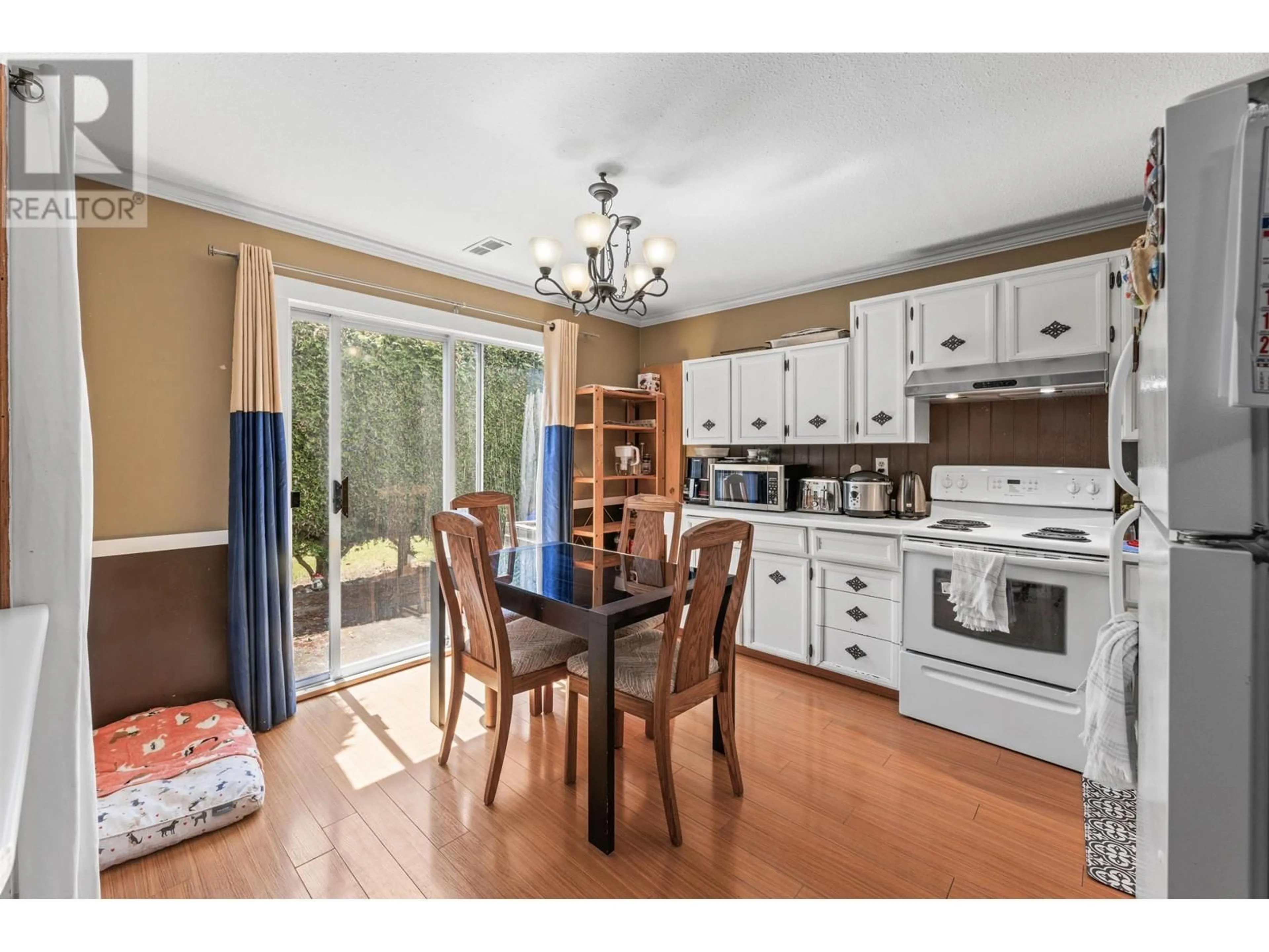 Open concept kitchen, wood/laminate floor for 4946 44B AVENUE, Delta British Columbia V4K1J1