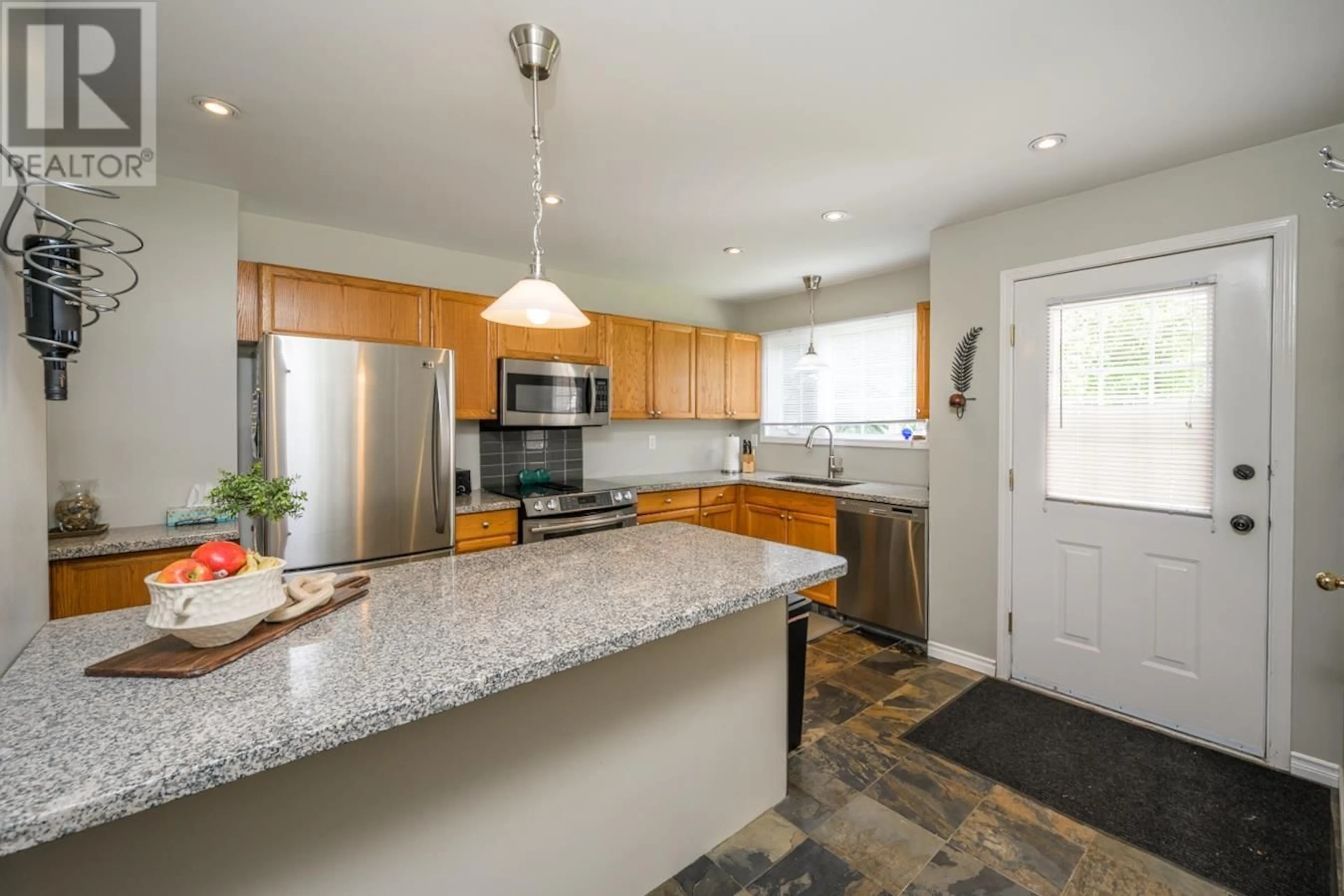 Open concept kitchen, ceramic/tile floor for 104 - 588 MELVILLE CRESCENT, Prince George British Columbia V2M1Y2
