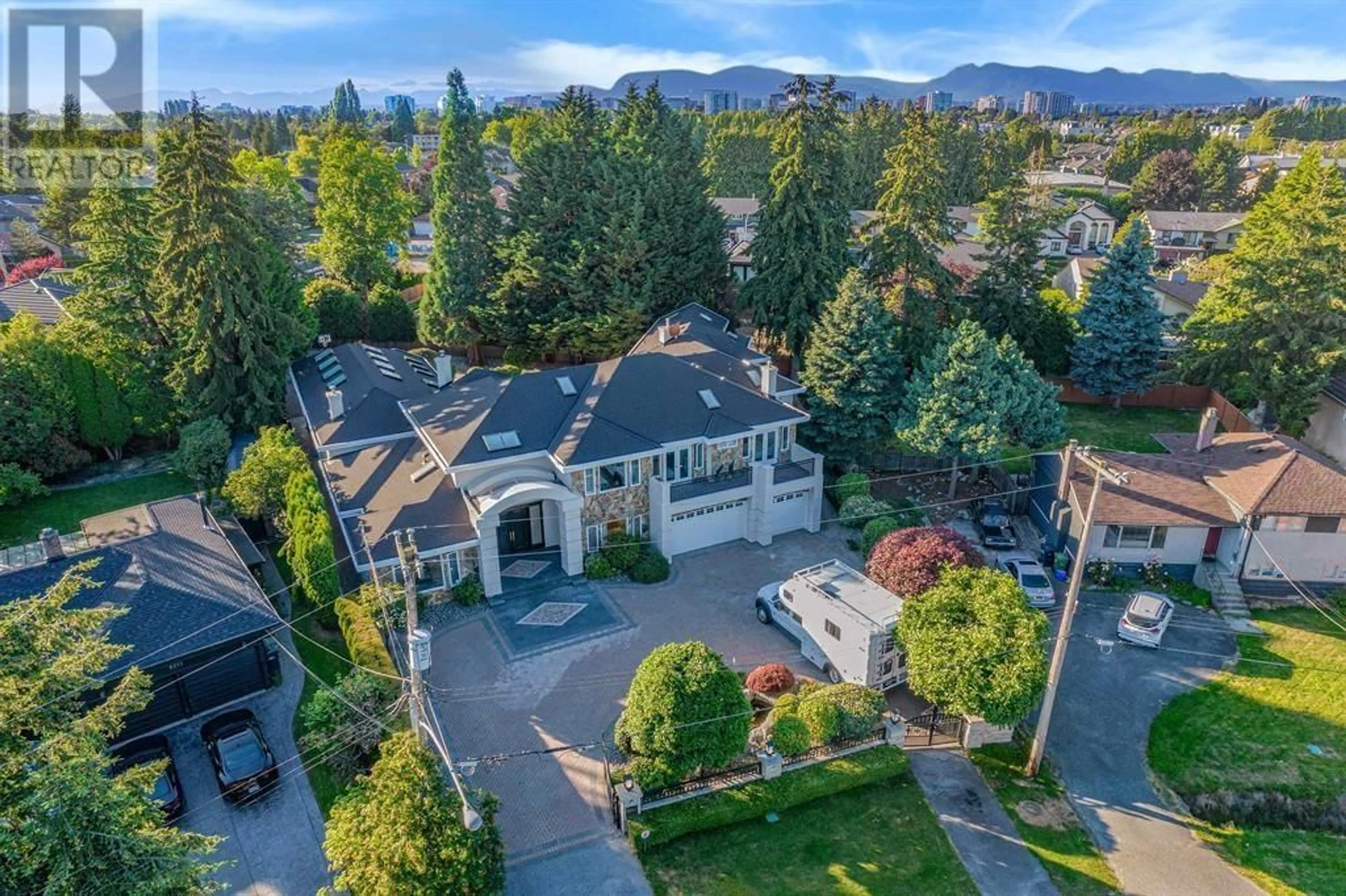 A pic from outside/outdoor area/front of a property/back of a property/a pic from drone, mountain view for 8231 BOWCOCK ROAD, Richmond British Columbia V6Y1C1