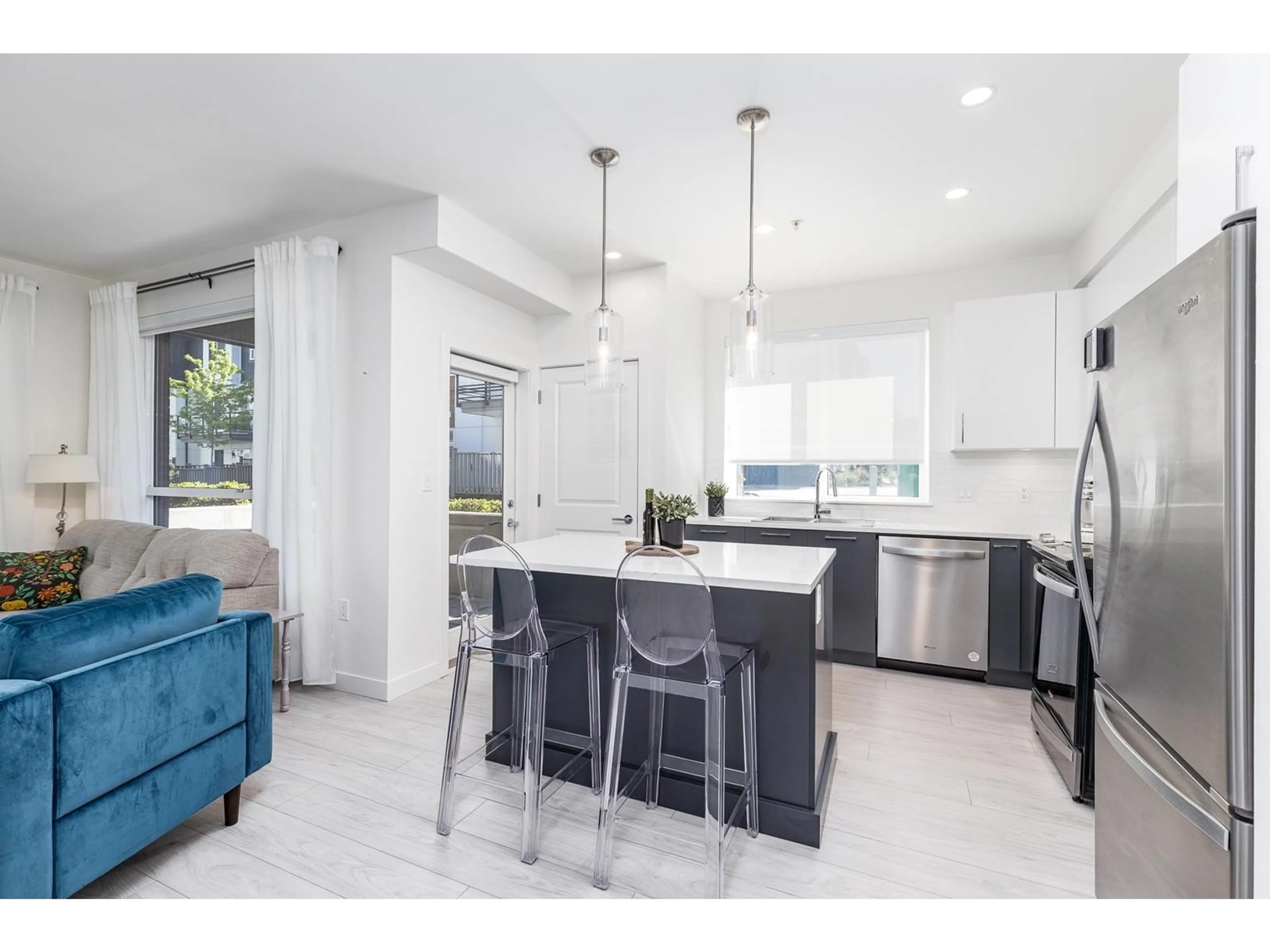 Open concept kitchen, ceramic/tile floor for A102 - 20834 80, Langley British Columbia V2Y3M3