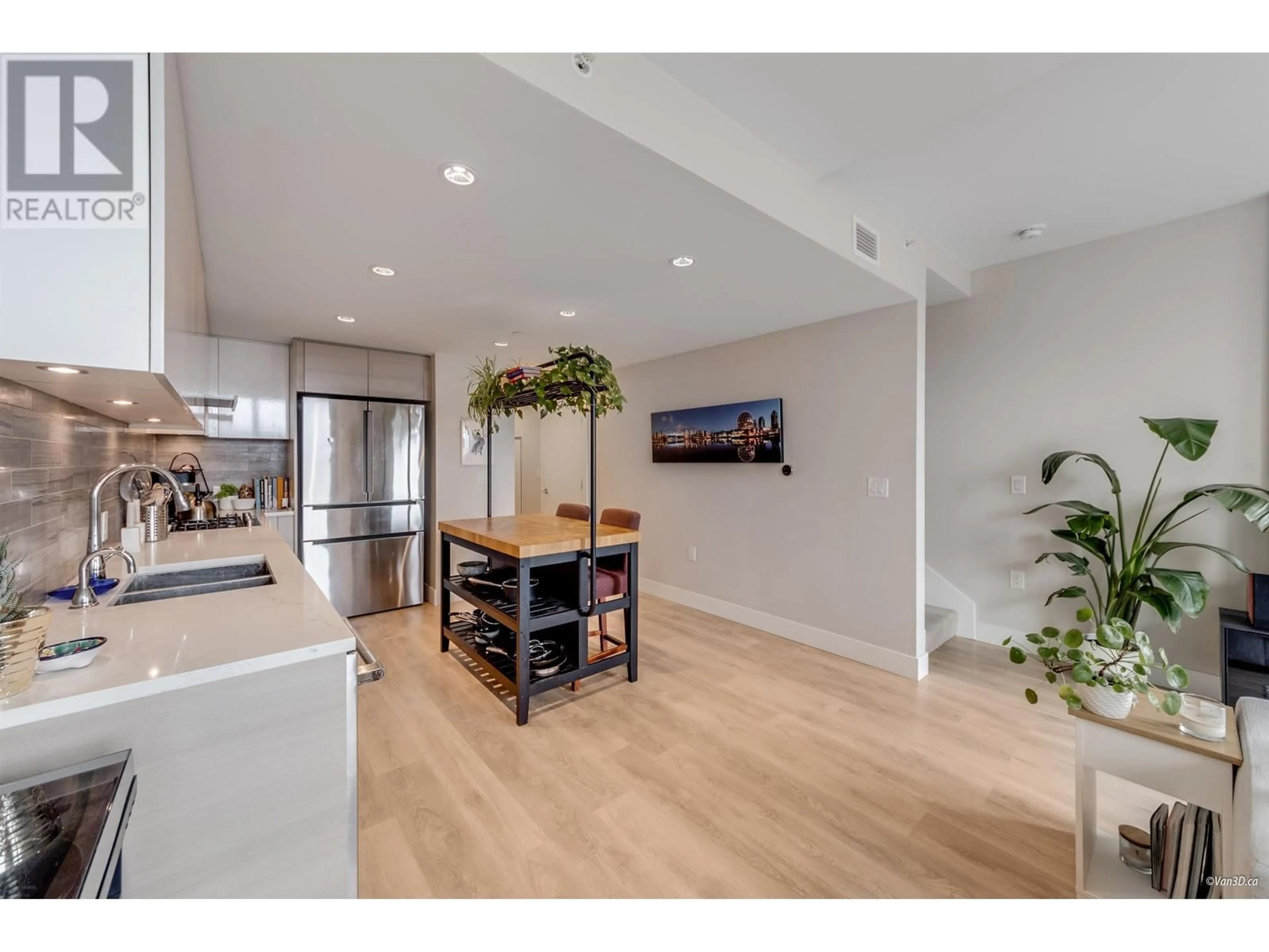 Open concept kitchen, wood/laminate floor for 505 - 3451 SAWMILL CRESCENT, Vancouver British Columbia V5S0H3