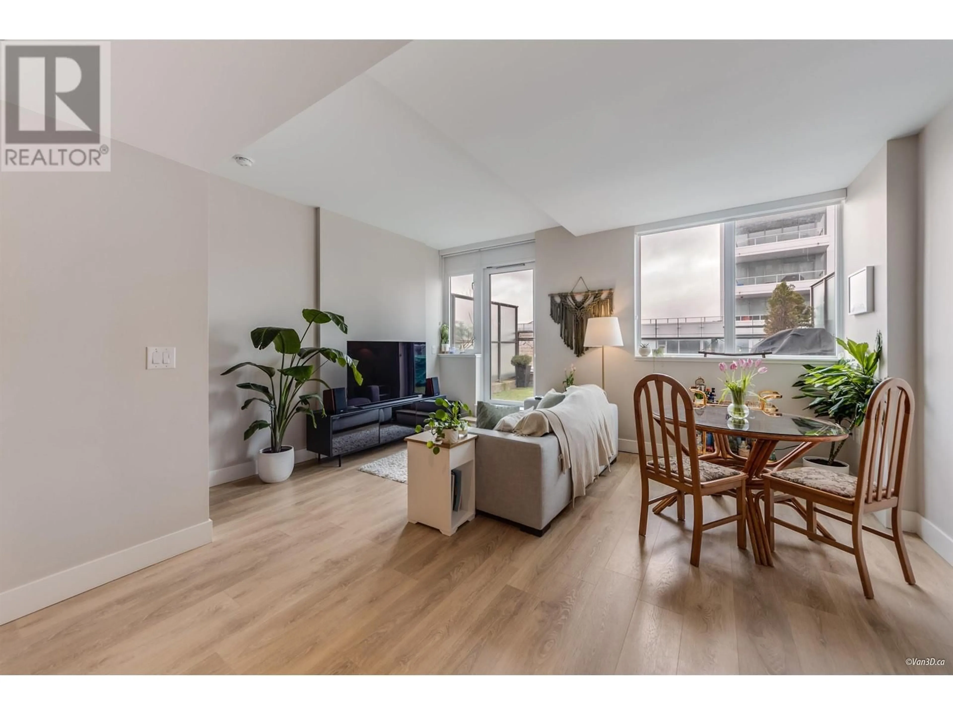 Living room with furniture, wood/laminate floor for 505 - 3451 SAWMILL CRESCENT, Vancouver British Columbia V5S0H3