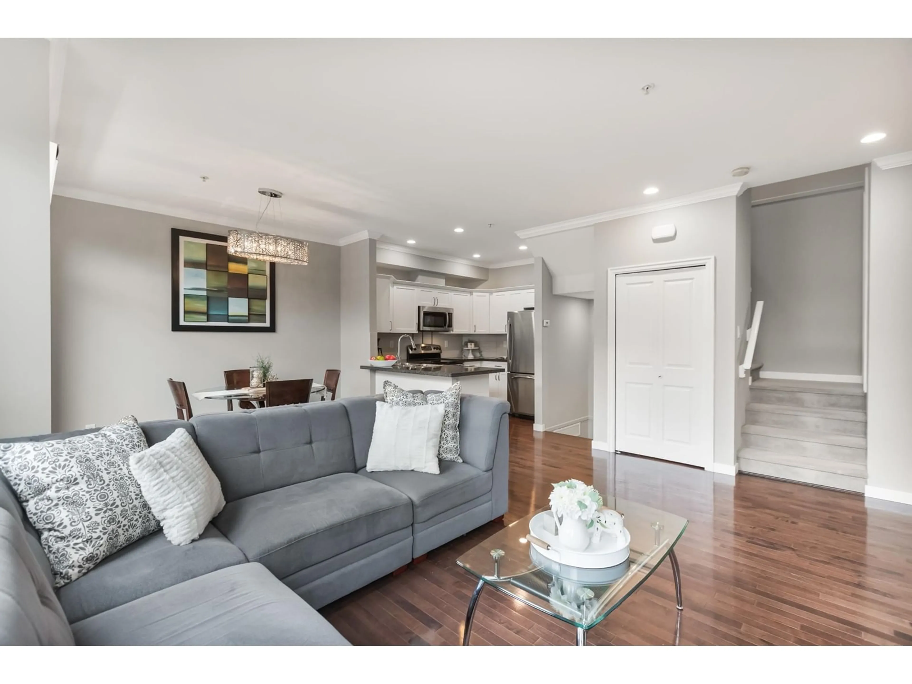Living room with furniture, wood/laminate floor for 4 - 20822 70, Langley British Columbia V2Y0G1