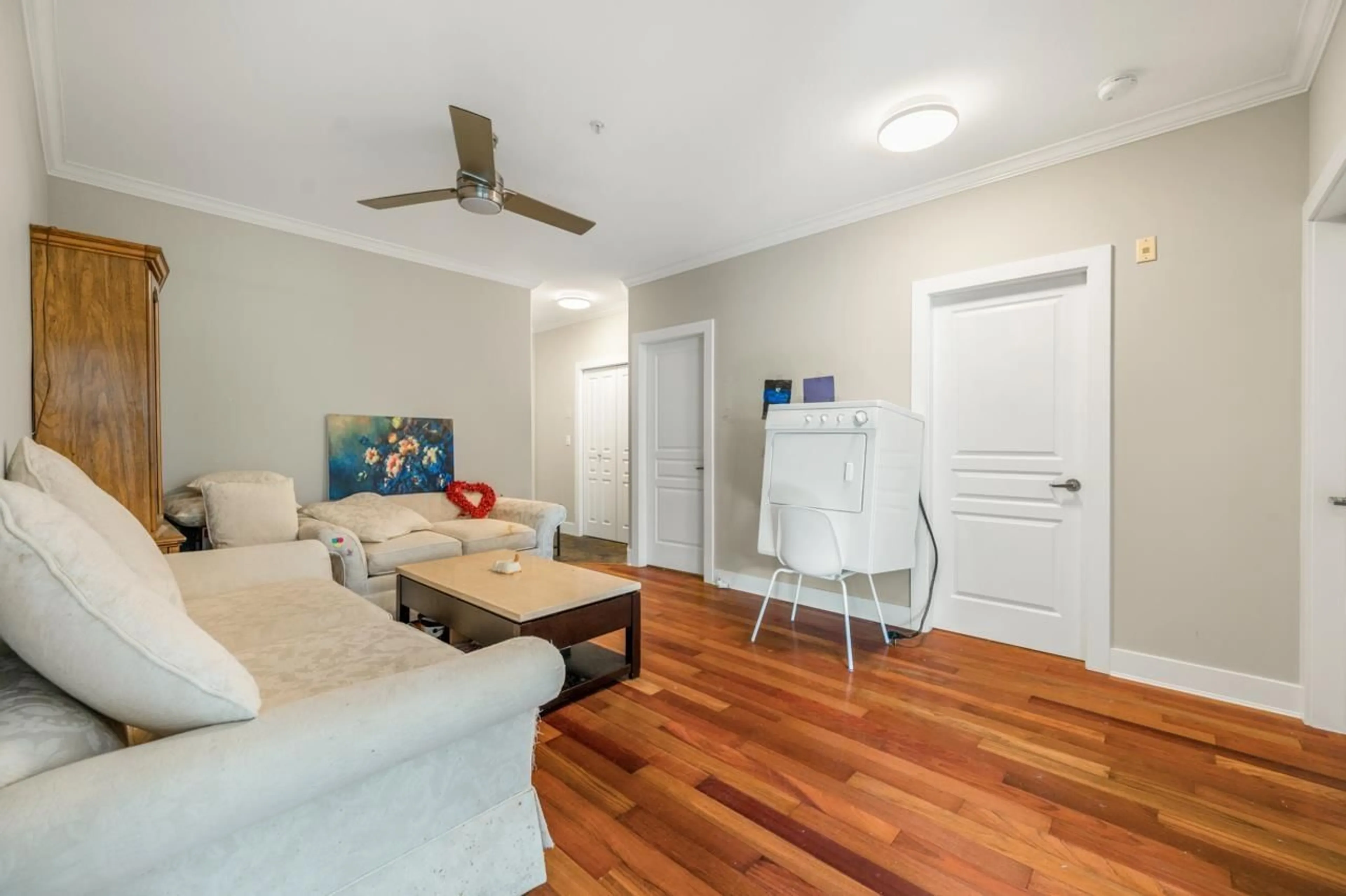Living room with furniture, wood/laminate floor for 105 - 1630 154, Surrey British Columbia V4A9T3