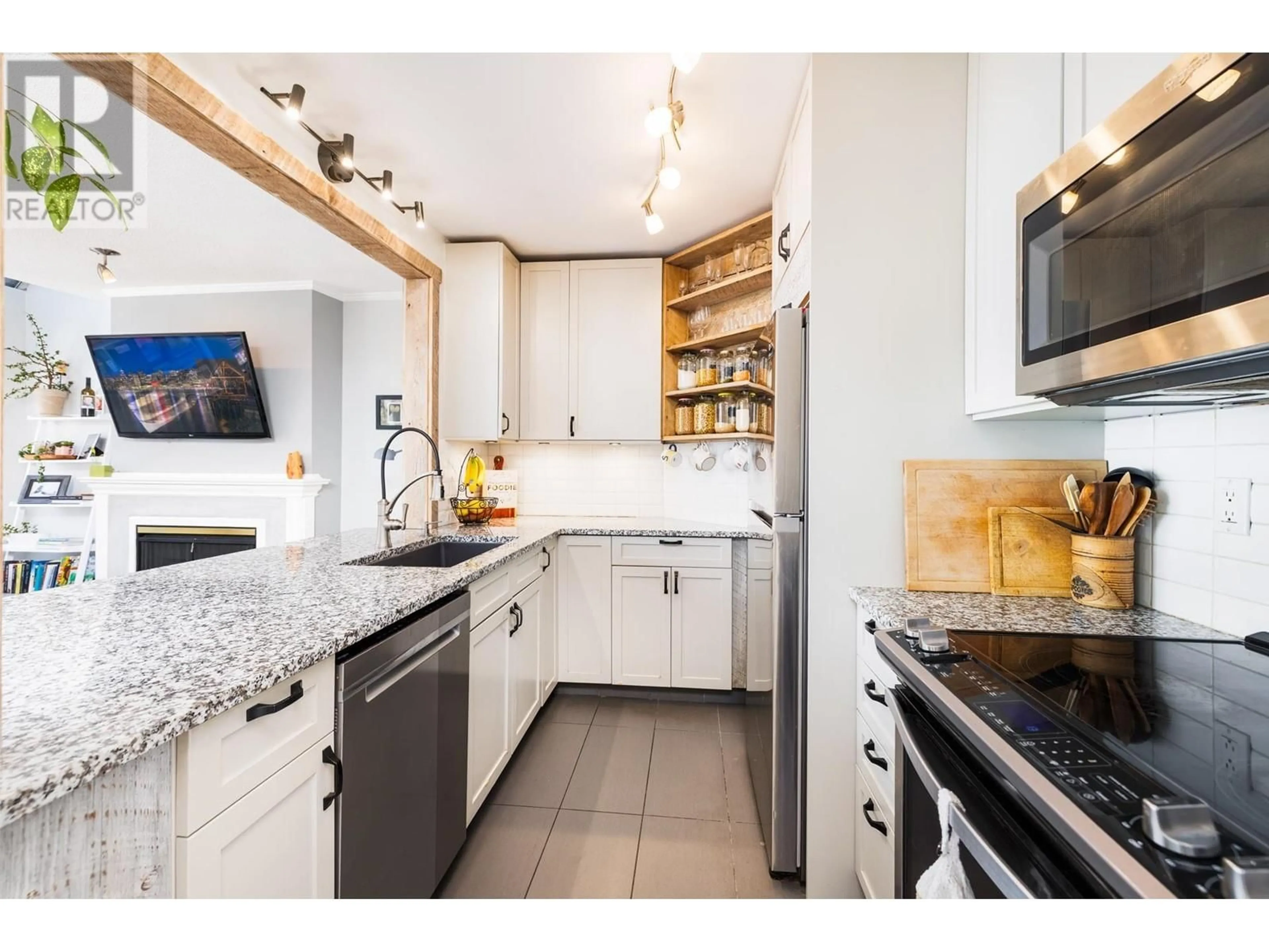 Open concept kitchen, ceramic/tile floor for 309 - 3721 DELBROOK AVENUE, North Vancouver British Columbia V7N3Z4