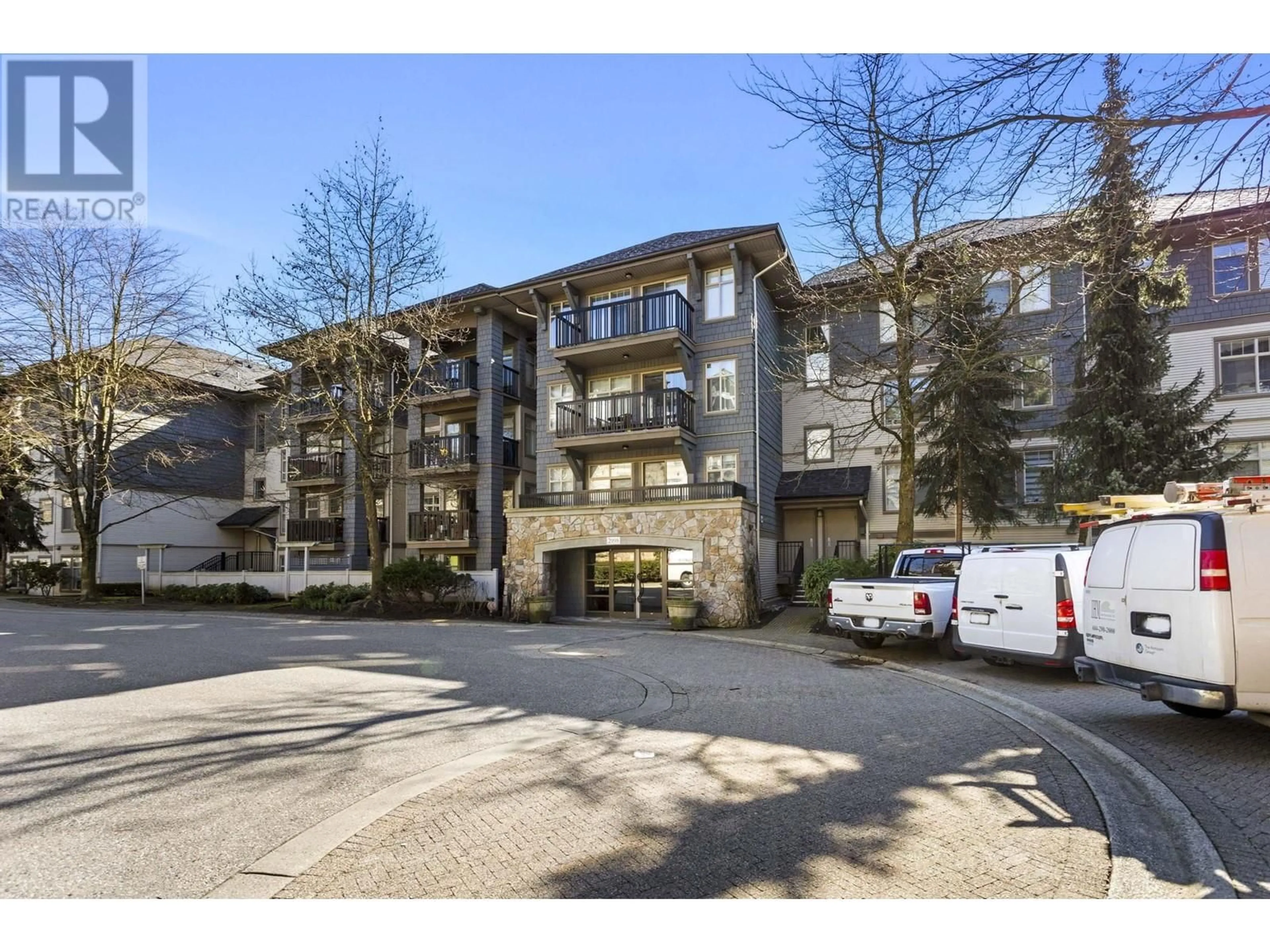 A pic from outside/outdoor area/front of a property/back of a property/a pic from drone, street for 207 - 2998 SILVER SPRINGS BOULEVARD, Coquitlam British Columbia V3E3R7