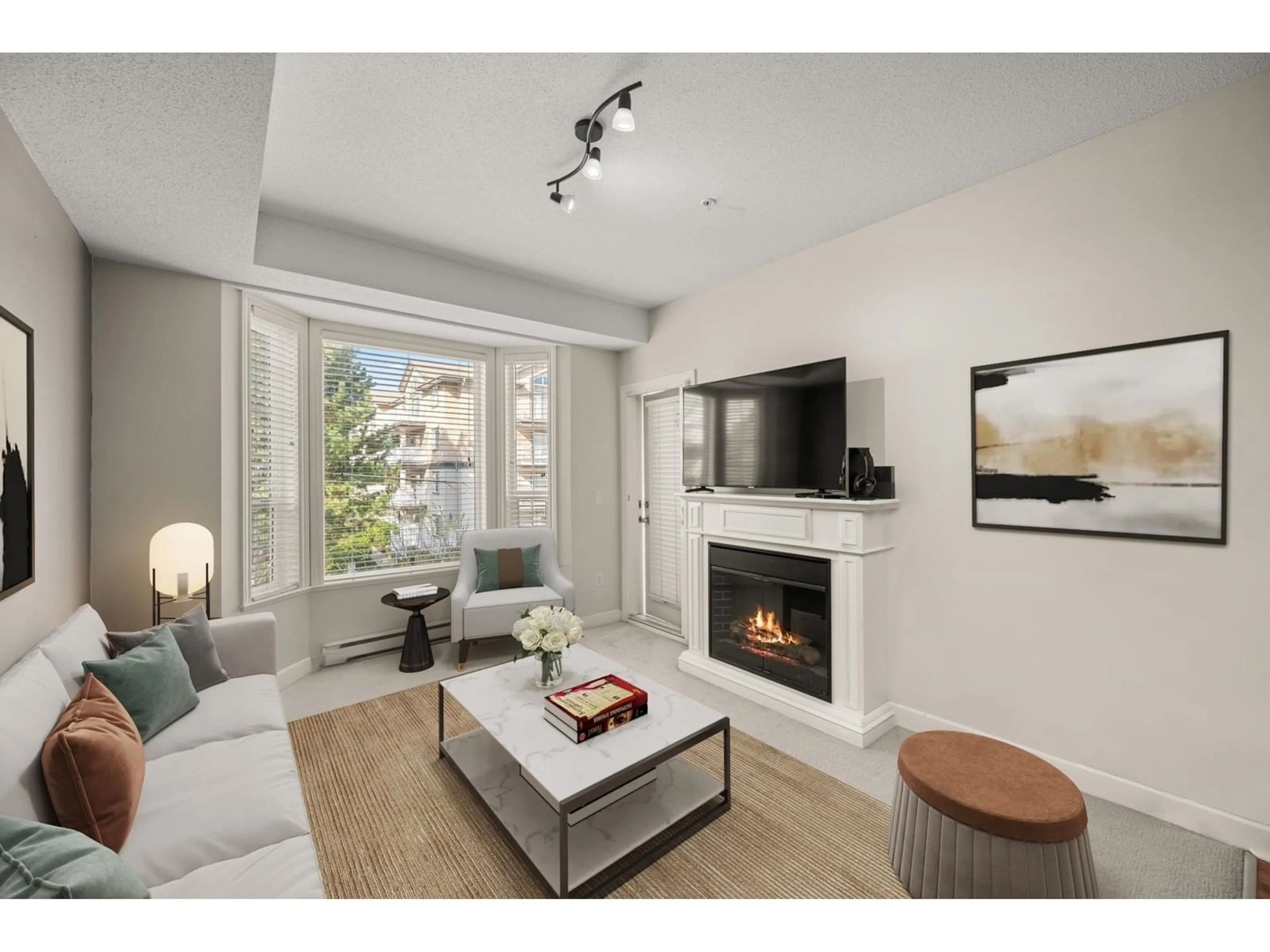 Living room with furniture, wood/laminate floor for 203 - 20281 53A, Langley British Columbia V3A3V6