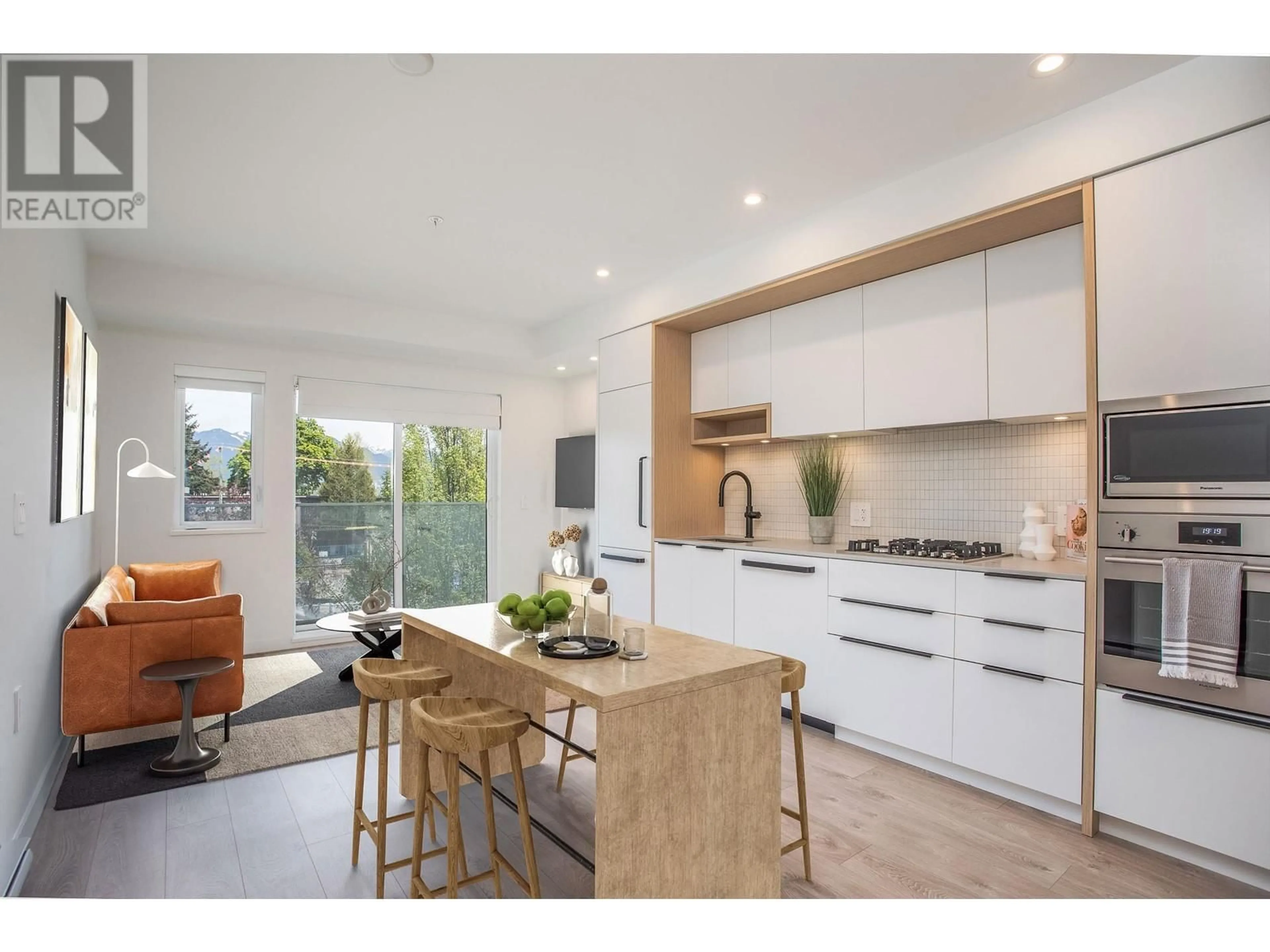 Open concept kitchen, wood/laminate floor for 210 - 2520 GUELPH STREET, Vancouver British Columbia V5T0K7