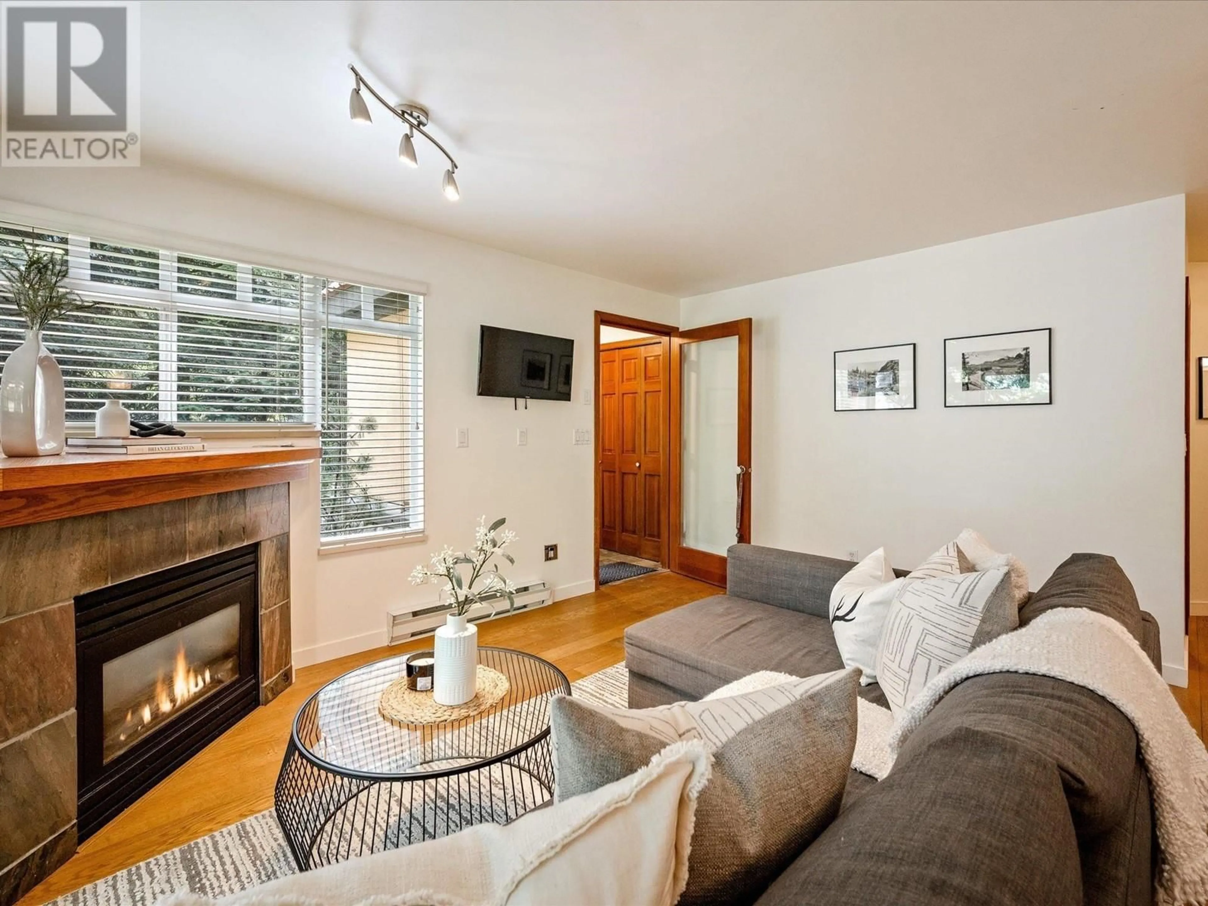 Living room with furniture, wood/laminate floor for 25 - 4325 NORTHLANDS BOULEVARD, Whistler British Columbia V0N1B4